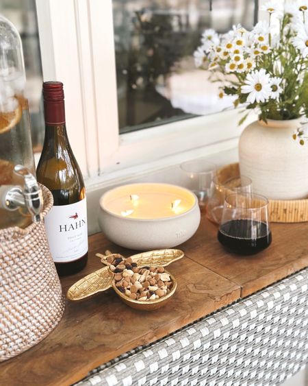 #ad Lowe’s (@LowesHomeImprovement) Spring Outdoor entertaining favorites for my patio console! I love this brass bee dish, citronella candle, faux daisies, rose colored stemless wine glasses and woven tray. Perfect for all backyard entertaining!☀️ #lowespartner  #loweshomeimprovement #backyardpatio #patio #entertaining #spring

#LTKSeasonal #LTKstyletip #LTKhome
