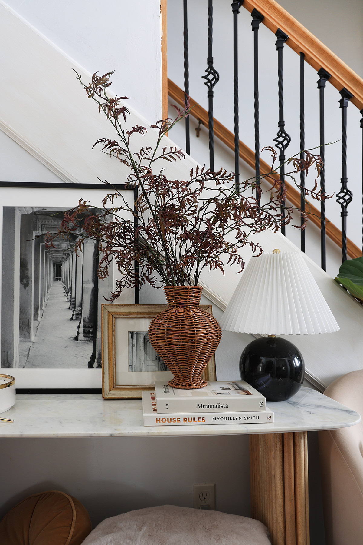 Entryway console styling | Woven rattan vase with stems | Fluted shade lamp | Wall art | Coffee table books  

 #LTKHome