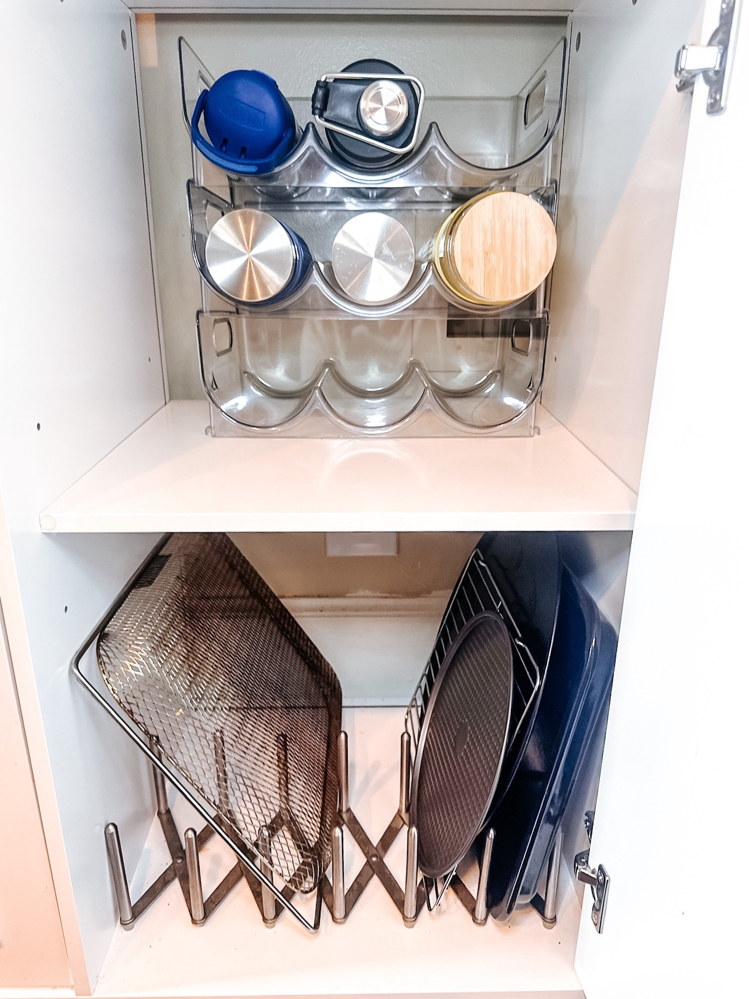 Proof that the right organizers make all the difference 🙌✨ This kitchen cabinet went from juggling bottles + pans to sleek + functional with an acrylic water bottle organizer and a sheet pan rack. Everything has its place, and nothing gets lost in the shuffle.

Ready to love the inside of your cabinets again? Let’s make it happen—free consultations available!

#GoVols #Knoxville #OrganizedHome

#LTKHome #LTKFamily