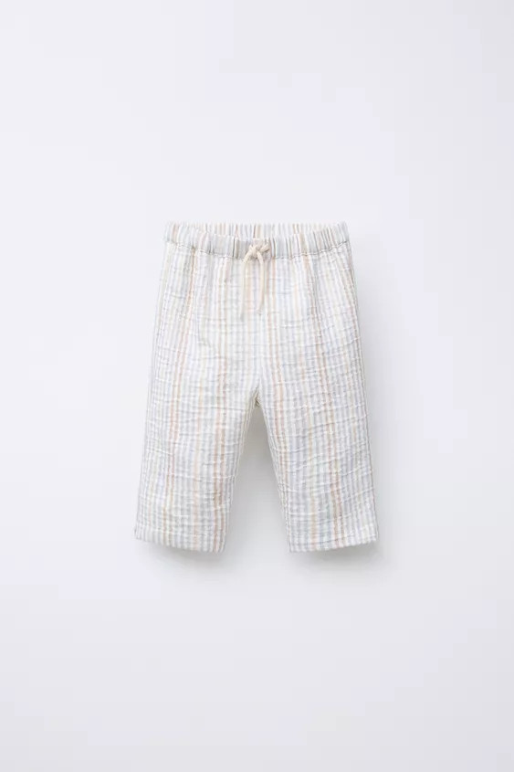 Pants with elastic waistband and front drawstring appliqué. Patch pocket on back. | Zara US
