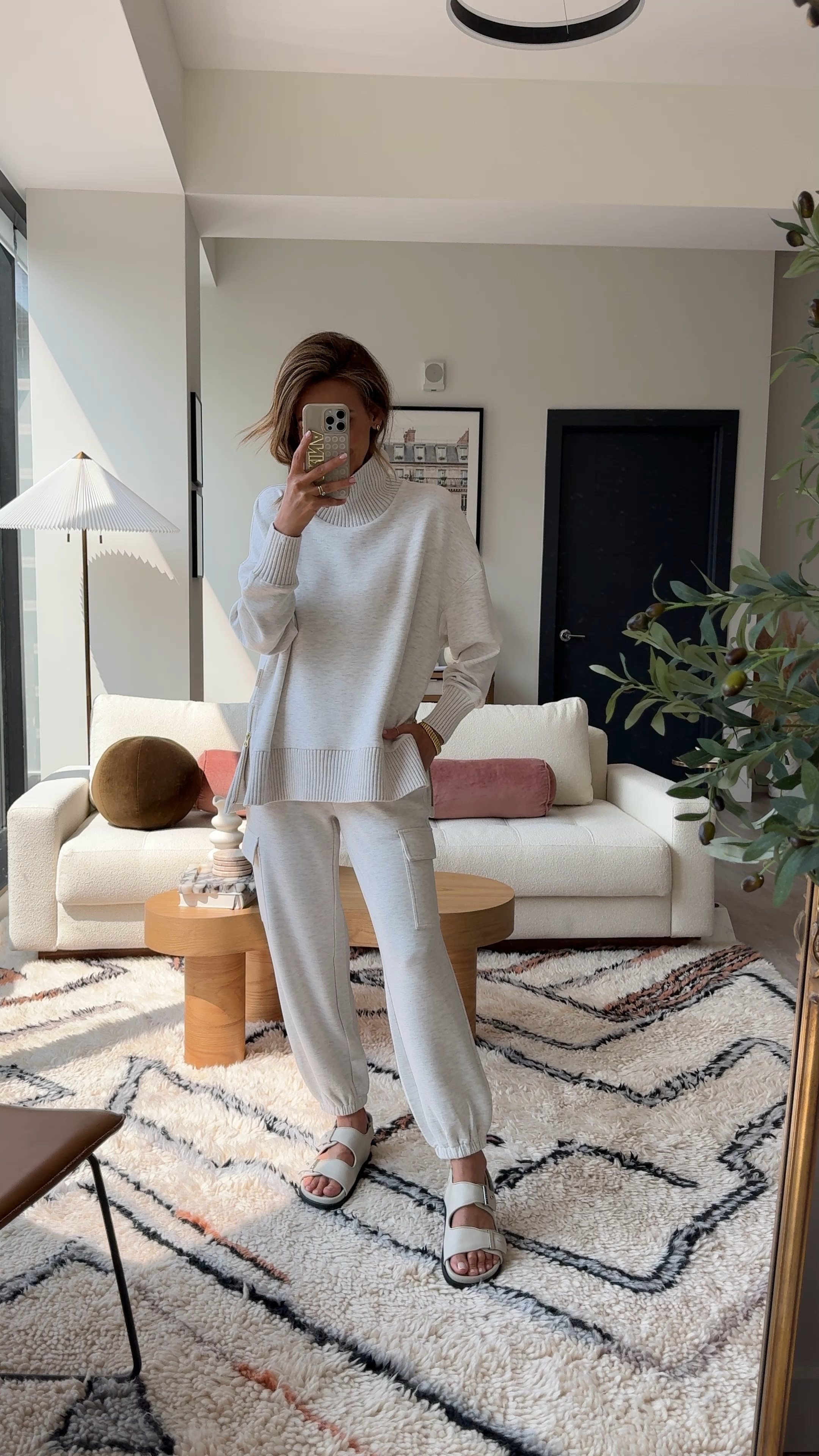 The chicest travel outfit idea! I love the high neck look with knitted material on cuffs and hem as well as the size zippers on sweater that allows more movement! The Cargo sweat pants is a nice update from a regular sweat pant. Both size XS @varley #invarley

#LTKTravel #LTKVideo #LTKStyleTip