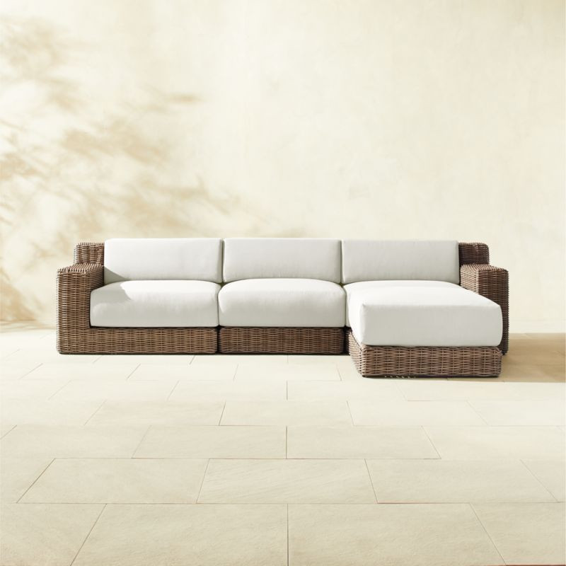 Maylin 4-Piece All-Weather Rattan Outdoor Sectional Sofa And Ottoman with Warm White Sunbrella Cu... | CB2