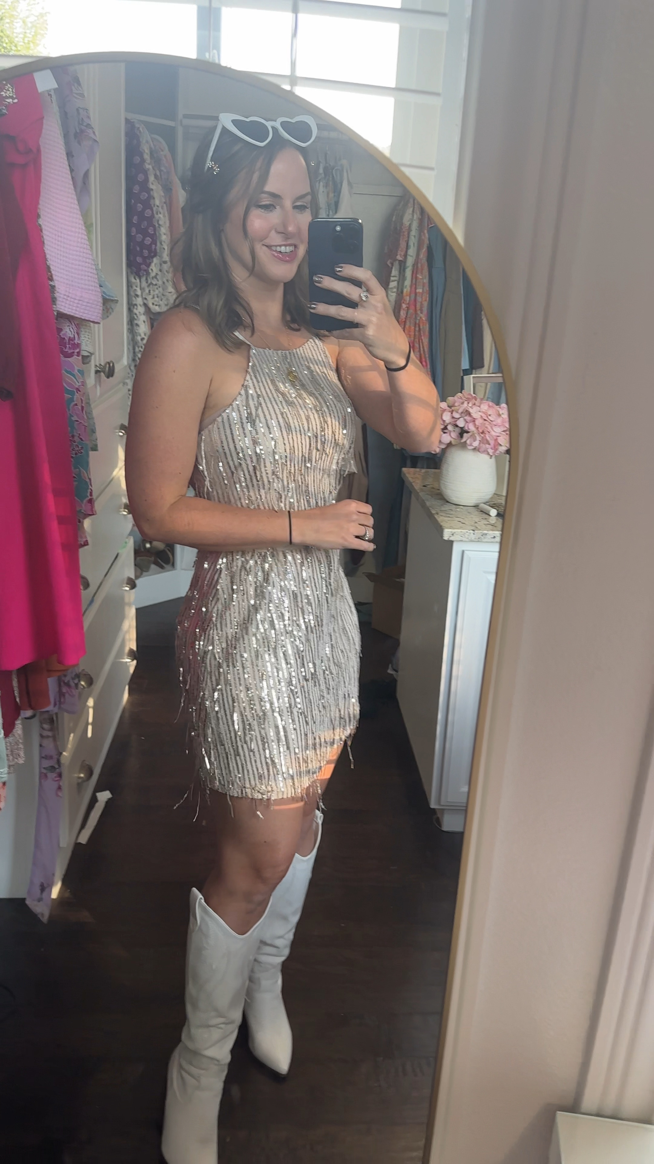 Got this fun little sparkly dress for a Meghan trainor concert! 🎶 Paired it with white boots, heart glasses and some sparkly hair clips. I ordered the dress in light pink and champagne to try and think I’m going to go with this one! I love it!!! 😻 it would be perfect for a Vegas trip, Taylor swift eras tour concert outfit, even as a Halloween costume with some go go boots or flapper costume. Too cute!!! 

Amazon fashion finds, Amazon dress, fall outfits, Home coming dress, party dress, cocktail dress, High neck shift dress, fringe dress, sparkly outfit, sparkle dress, Vegas outfit, Meghan trainor timeless tour outfit, semi formal dress

#LTKVideo #LTKStyleTip #LTKFindsUnder50