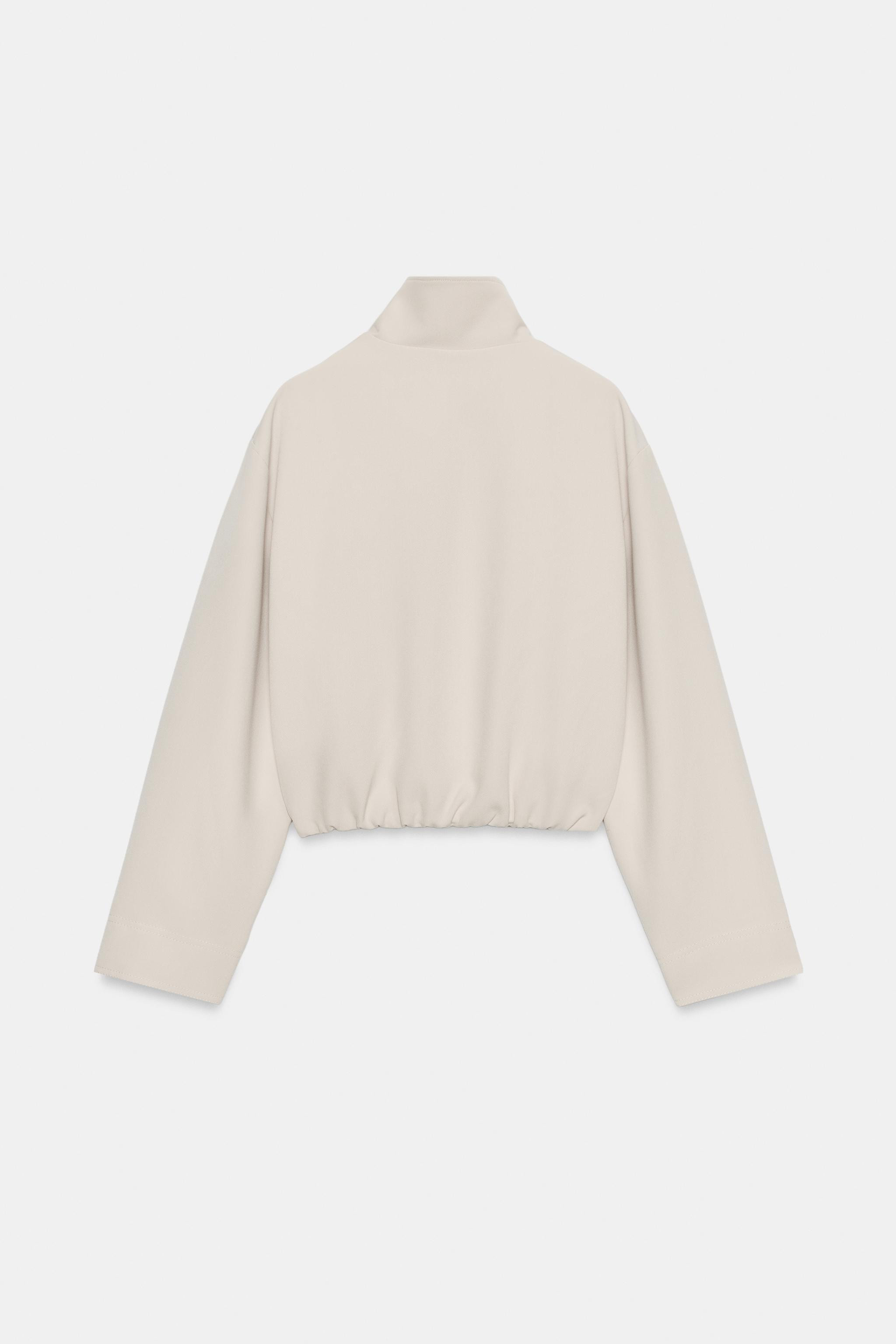 Bomber-style jacket with a high collar and long sleeves. Featuring hidden side pockets in the sea... | Zara UK