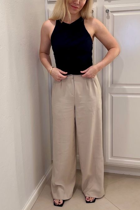 Black top
Pleated pants 
Black strappy sandals 

Summer outfit 
Summer 
Vacation outfit
Date night outfit
Spring outfit
#Itkseasonal
#Itkover40
#Itku

#LTKFindsUnder50 #LTKFindsUnder100 #LTKShoeCrush