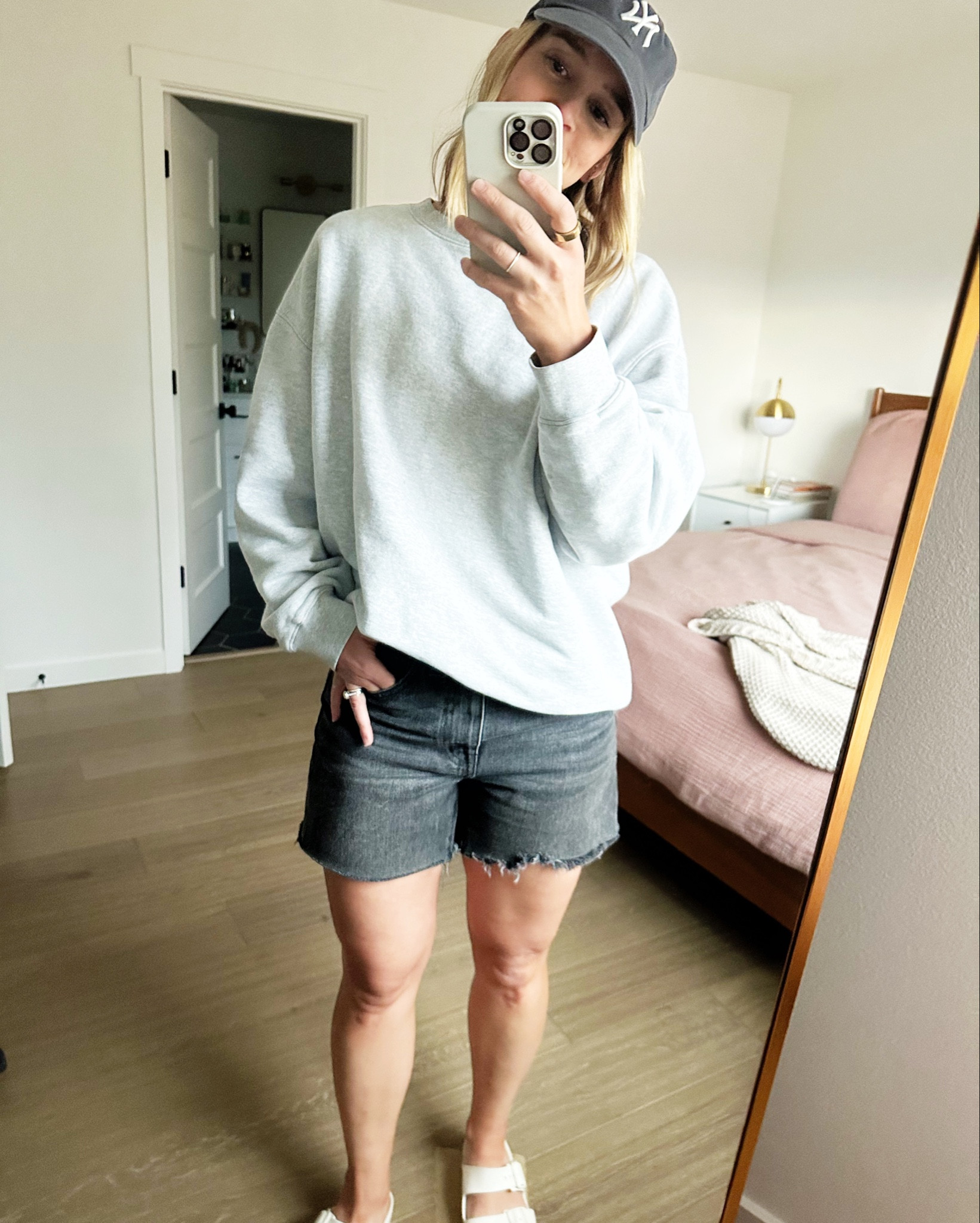 Mom uniform. Wearing one of my fave organic sweatshirts, high rise jean shorts and baseball caps. Not the exact same baseball cap but similar. 