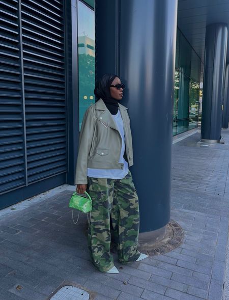 Autumn ootd using the sandwich rule. Camo cargos, sage green biker jacket, white slingback. I’ve linked alternatives for the unavailable pieces.

#LTKfindsunder100 #LTKSeasonal #LTKstyletip