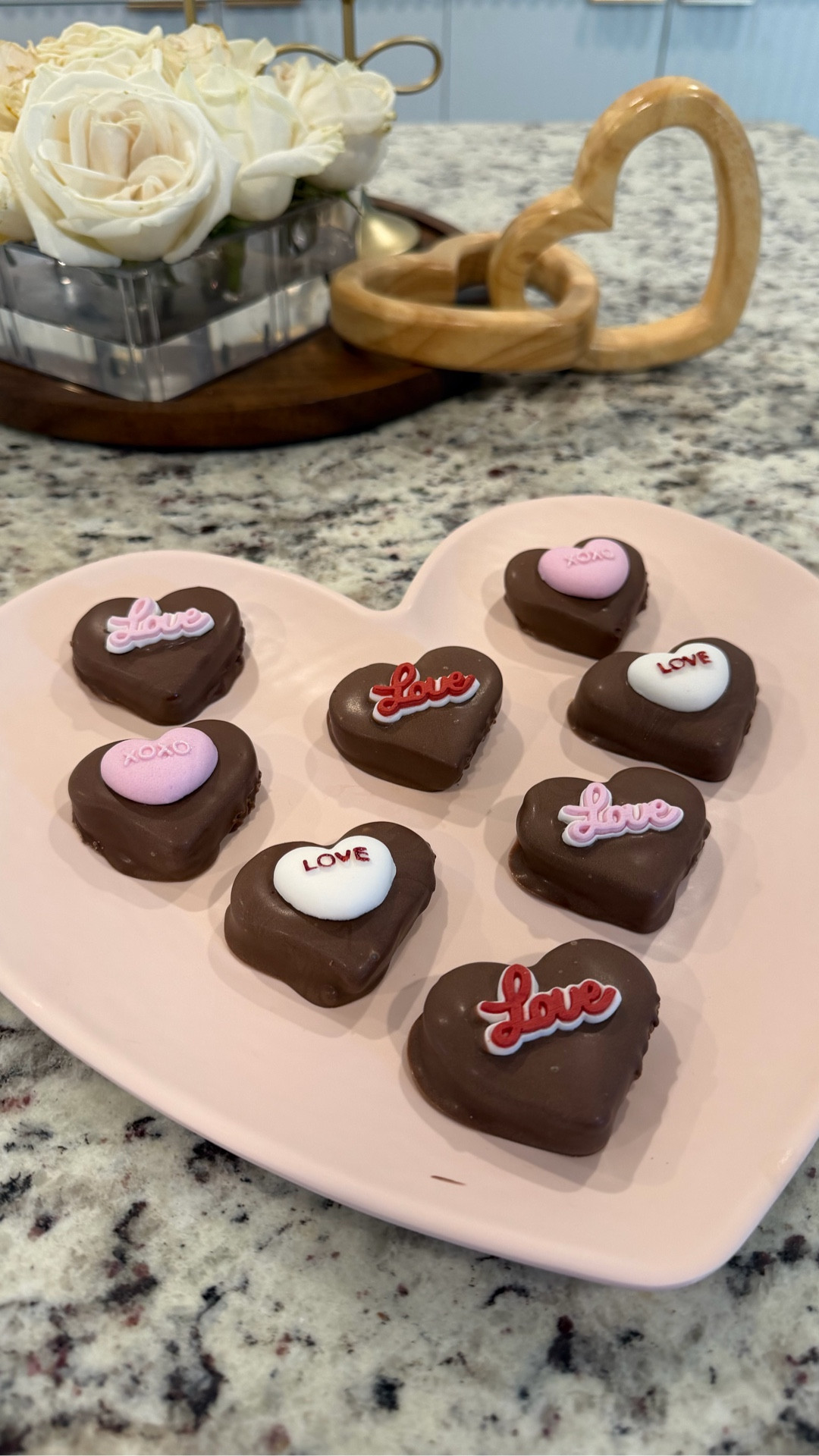 POV: You’re a mom who wants a Valentine’s treat… but also trying to meet your protein goals 💘💪

These Protein Peanut Butter Hearts are my current hyperfixation and they live rent free in my freezer. Sweet, chocolatey, and made with 4 real ingredients — aka the kind of treat that doesn’t send you on a sugar spiral at 9pm.

✨ No baking
✨ Naturally sweetened
✨ Protein-packed
✨ Mom-approved

RECIPE 👩‍🍳
-1/4 C almond flour
-1/2 C Peanut butter (I use organic, no added sugar or salt from @traderjoes 
-1 scoop of vanilla protein powder (I use @flavcity Vanilla cream)
-Melting chocolate (I used @lilys_sweets milk chocolate bc it doesn’t have added sugar)
-Decoration (optional)

Mix almond flour, protein powder and peanut butter into a dough. Roll out 1/2 thick and cut out with whatever shape you like.  (I used a 2” heart cutter for this) place hearts on a parchment lined cookie sheet and place in freezer for at least 2 hours (I did overnight). Melt your chocolate per instructions.  Dip, decorate and devour.  

10 grams of protein for 2 hearts 🤍
*I don’t count macros so I only calculated the protein based on what I used. 

✨SAVE this for your next healthy dessert craving 
✨SHARE with a mom friend who hides snacks in the freezer so the kids don’t find them 😌
✨Comment TREAT for a list of what I used
✨FOLLOW for more decor and sweet treats, 

#HighProteinRecipes #HealthyDessertIdeas #ProteinSnacks #MomLifeHacks BetterForYouTreats NoBakeDessert ValentinesDayTreats HealthySweets BusyMomLife GlutenFreeDesserts RefinedSugarFree FreezerTreats

#LTKfoodie #LTKfitnessgoals #LTKValentine