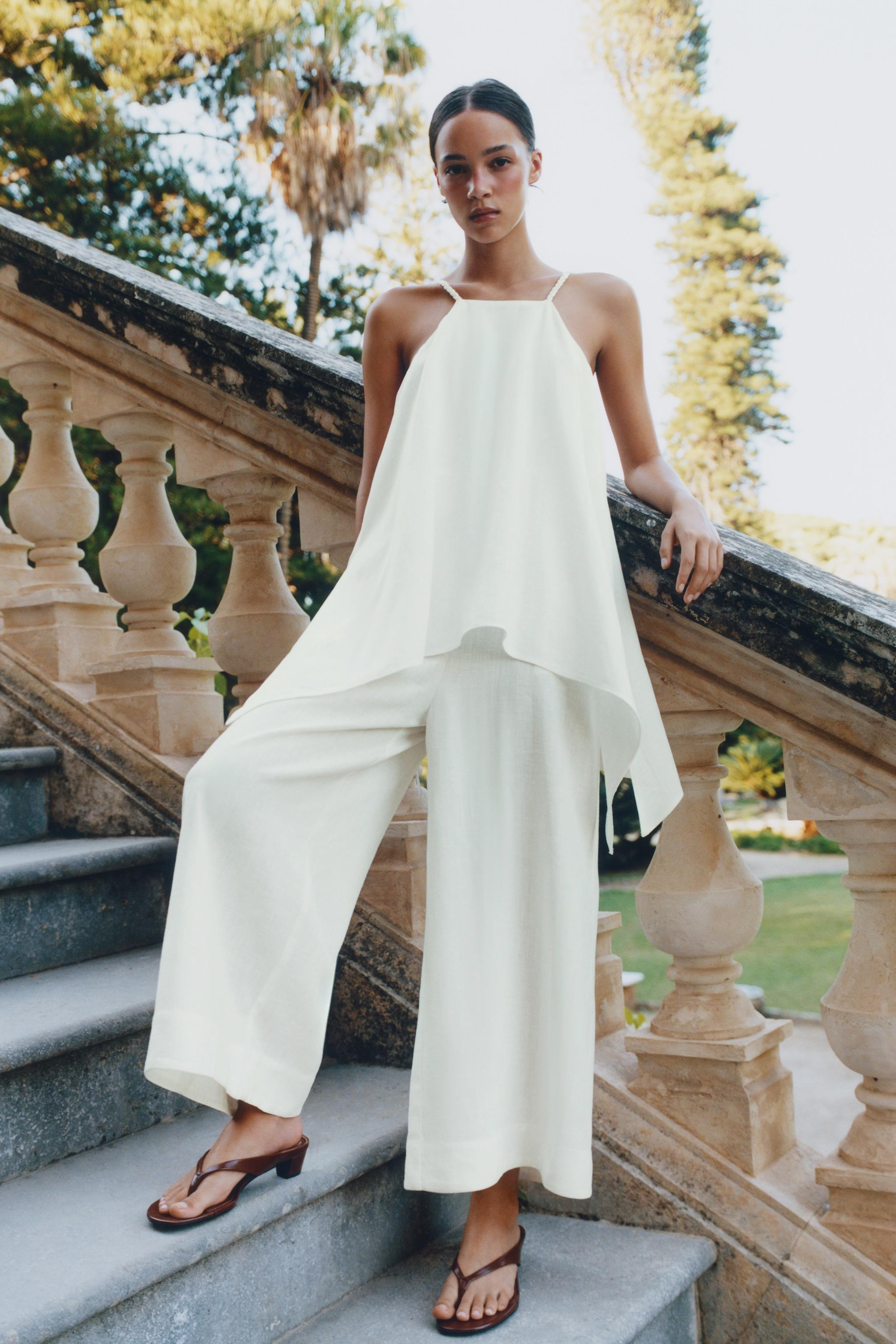 Jumpsuit made of ramie. Halter neckline with spaghetti straps. Hidden in-seam side pockets. Wide ... | Zara US