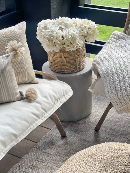 HOME \ outdoor side table find from Amazon - only $86 and looks SO good👏🏻 Basket and faux hydrangeas from Walmart!

Patio
Decor 
Deck 

#LTKSeasonal #LTKHome #LTKFindsUnder100