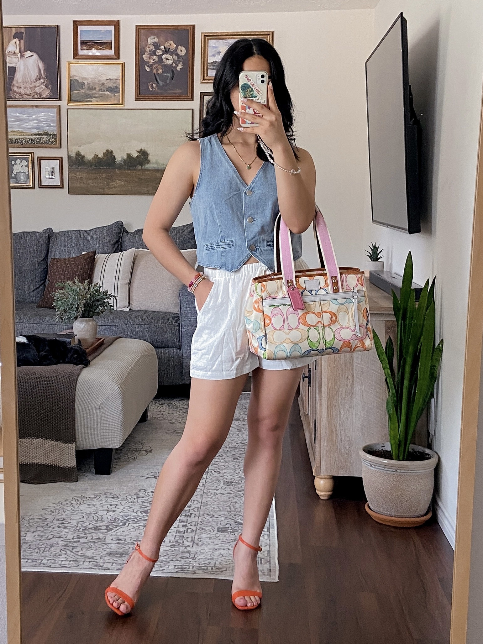 Wearing the top and bottoms in a size large for an oversized fit. The shorts have a stretchy, elastic waistband, are double lined, and have pockets. The denim vest top is chic, versatile, and a staple  

#LTKSummerEdit #LTKStyleTip #LTKSeasonal