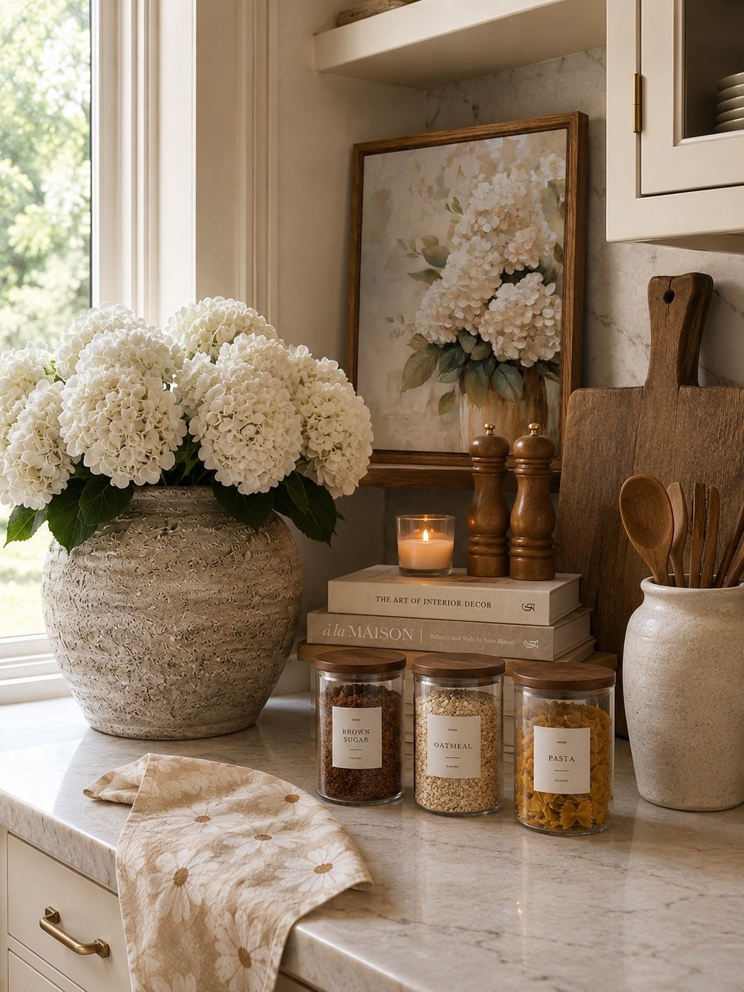 Kitchen Counter Styling You’ll Love 🤍🌿

A beautifully styled kitchen doesn’t have to be complicated. Layering fresh florals, warm wood accents, glass canisters, cookbooks, and timeless kitchen essentials instantly creates a space that feels collected, cozy, and welcoming. This neutral kitchen vignette blends function and beauty, proving that everyday items can double as decor.

From hydrangeas and cutting boards to pantry canisters and decorative accents, these classic finds add warmth, texture, and charm to the heart of your home while keeping your countertops feeling intentional and organized.

Follow @farmtotablecreations on Instagram for more cozy home finds and trending decor.

#LTKHome #KitchenDecor #KitchenStyling #AmazonHome #HomeDecor #KitchenInspiration #CountertopStyling #NeutralDecor #CozyHome #FarmhouseStyle #ModernFarmhouse #Hydrangeas #KitchenOrganization #HomeFinds #KitchenRefresh #DecorInspiration #InteriorStyling #TimelessDecor #FarmToTableCreations #LTKStyle

#LTKSaleAlert #LTKHome