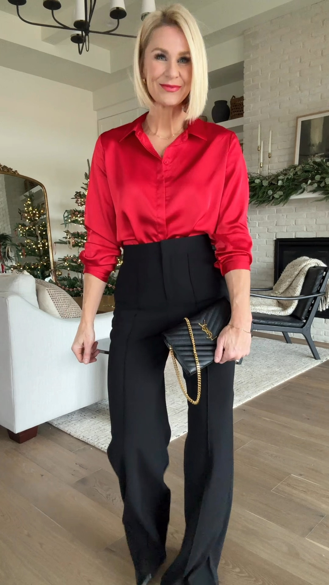 I get why this satin top has 100s of 5⭐️ reviews! It wears well, no gapping b/w buttons and is the prettiest cherry red. Easy, last minute grab! 
These black trousers are one of my favorite splurge purchases, ever. I’ve had them for years and grab for them over and over again. some reviews say they fit small. I disagree! They’re long, but are easy to hem if need be.

Christmas outfit
Holiday outfit 

#LTKSeasonal #LTKHoliday #LTKParties