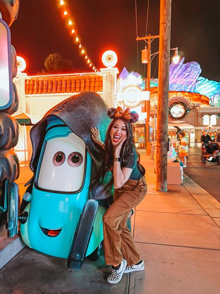 Fall Outfits for your next Disney Parks vacation! Wore these super cute and comfy overalls/jumpsuit, paired with a long gray tee, &  slip on vans! The burnt orange color of my overalls/jumpsuit worked perfectly with my orange-gingham ears for HalloweenTime here at the Disneyland Parks! #HalloweenOutfits #DisneyStyle #DisneyOutfits 

#LTKstyletip #LTKHoliday #LTKSeasonal