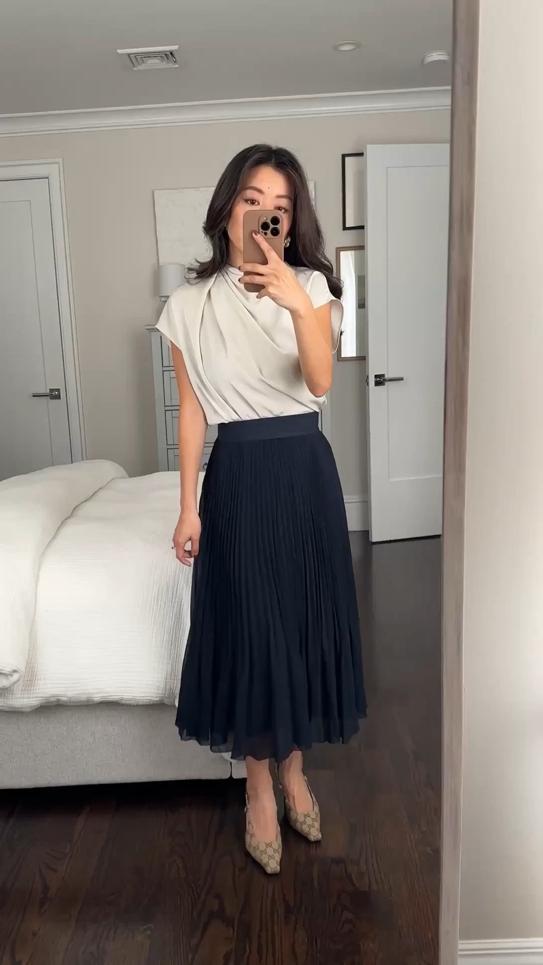 Size info below! • Aritzia Blouse XXS. Mine is an old color but loving the look of the new Seaside Cream! I also have navy.

Roomier fit with lightweight fabric that drapes and tucks in fluidly. I wear a neiwai bra for coverage under around the armholes. 

•Twirl pleated skirt in navy xxs - stretch waist and very floaty! I have a 25” waist and this is the xxs which sits higher at my natural waist. 
I also tried XS which is slightly looser on me, measures 12.25” across the elastic waist band (has stretch).

Petite friendly workwear, elegant style

#LTKPetite #LTKWorkwear #LTKootd