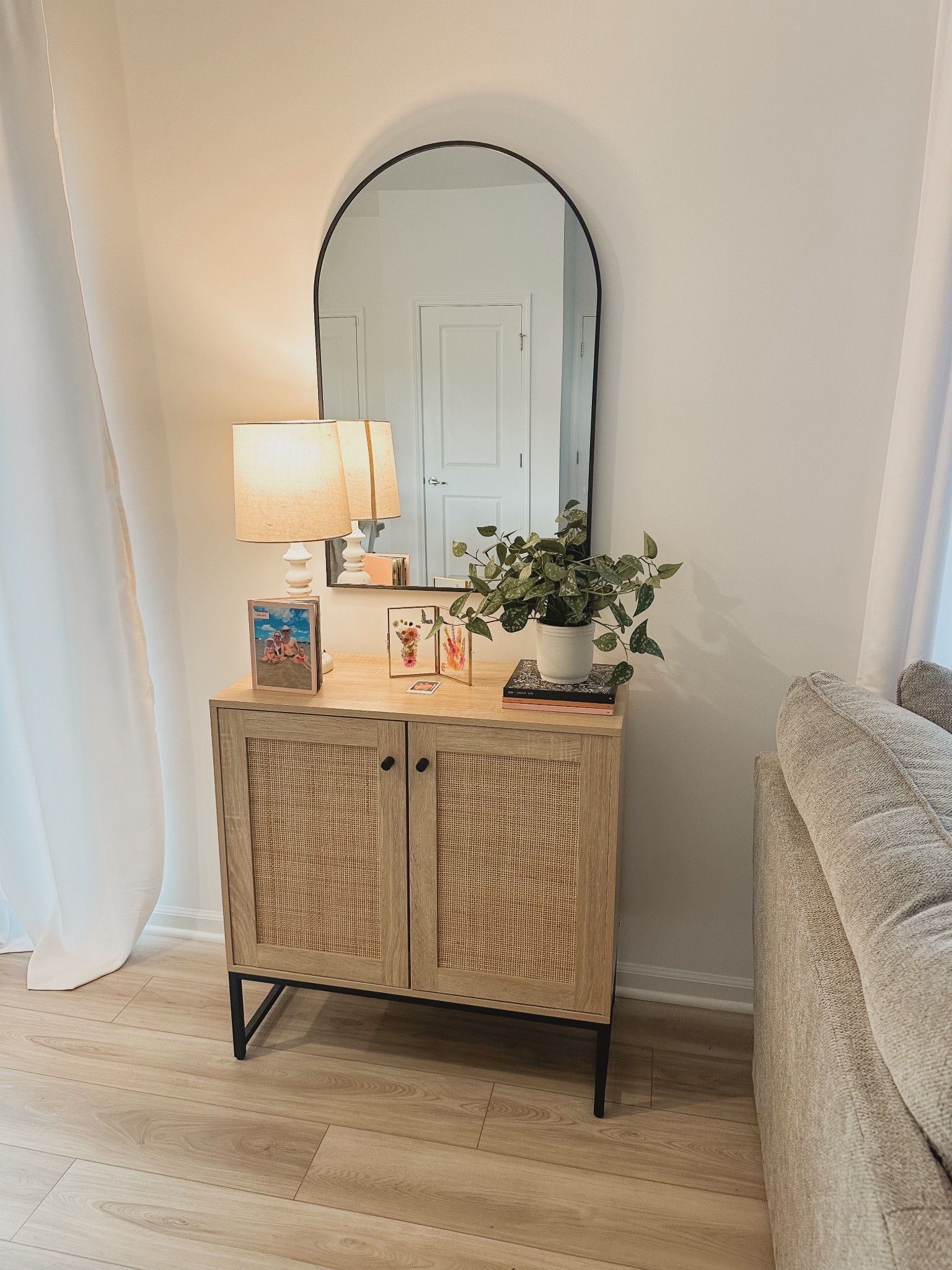 New arch mirror for above the rattan cabinet size 24x36

#LTKHome #LTKStyleTip