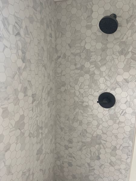 Master bath shower
Master bathroom hardware
hexagon ceramic shower wall
Black shower hardware 
Master bath inspo
Marble shower

#LTKhome #LTKFind