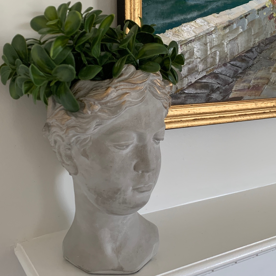 The cutest mantel or bookshelf decor 🌿 I may try some Japanese Cherry Blossom stems in the pot next!

#decor #mantel #mantle #bookshelf #homedecor #eclecticdecor #den #dendecor #barcart #homedecor #plants #bust #anthropolgiehome #anthro #livingroom #bedroomdecor 

#LTKSeasonal #LTKHome #LTKFindsUnder50