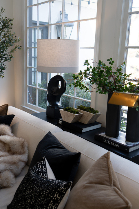 EEK I just styled my living room window nook and I cannot stop staring!! Cozy neutral decor, modern black accents, layered throw pillows, sculptural table lamp, stacked coffee table books, and fresh greenery bringing the perfect luxury home aesthetic. This bright airy space feels straight out of an interior design magazine and I’m obsessed with these warm, calm vibes!  

 #LTKmomlife #LTKHome #LTKSaleAlert