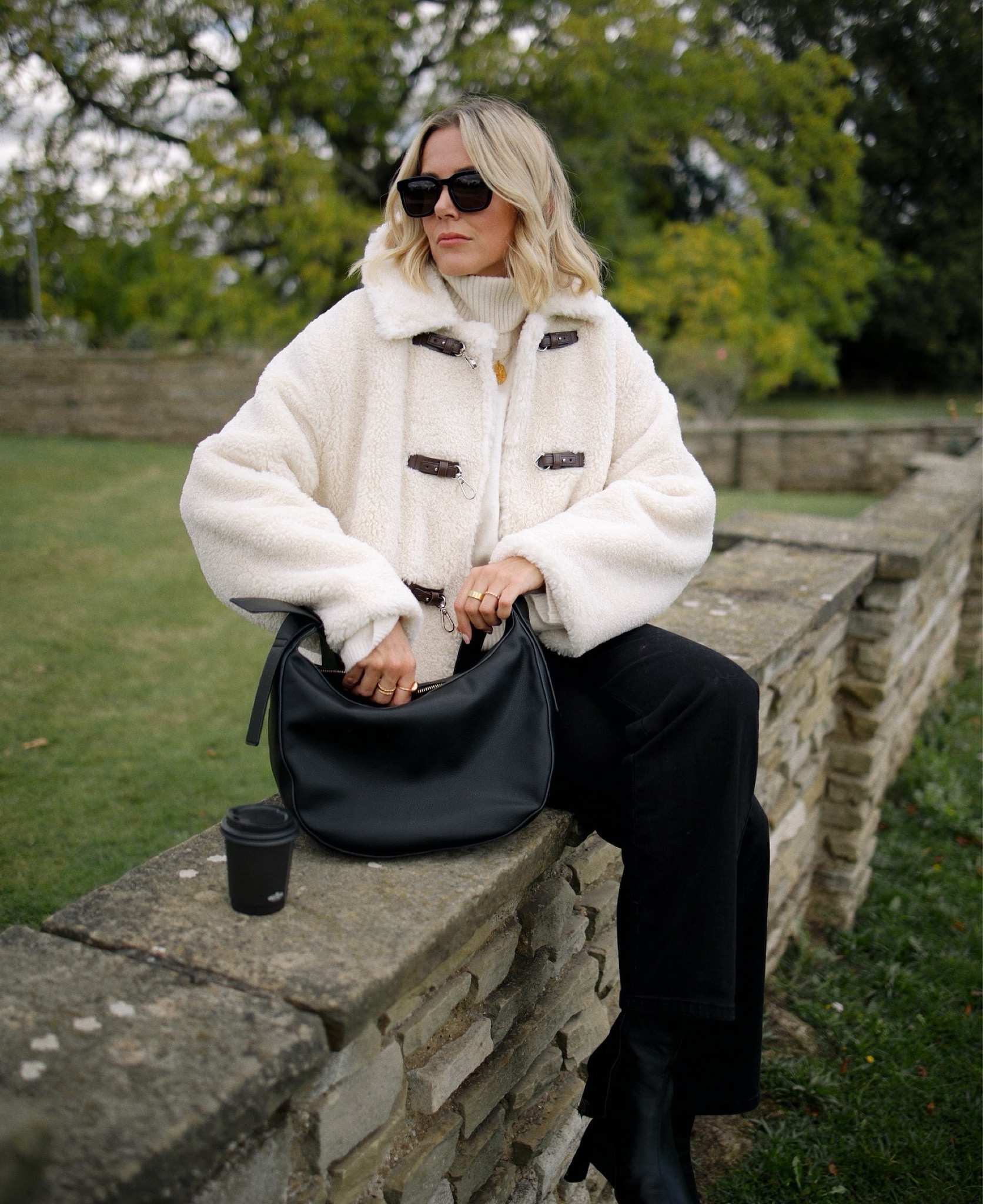 Autumn coat 
Winter coats 
Shearling jacket
Toteme style jacket
Faux fur coat 
Sling bag 
Black jeans 