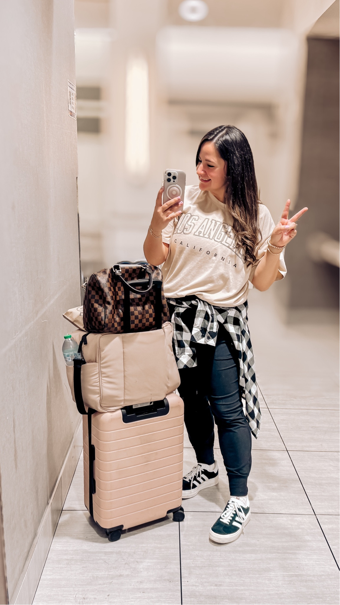Travel outfit and all my travel essentials! ✈️🧳

After flying standby for the last six years, I’ve gotten packing in only a carry on bag down to a science 🧪 

This is the away carryon and I will never use another luggage brand! After 5 years my original bag had some zipper ware and they sent me  a brand new one for free with their lifetime warranty!

My Luka duffel bag is not only cute but fits a ton! It has a bunch of internal pockets and a special shoe pockets too!

I’ve also included my
Toiletry bags and jewelry travel cases. 
Plus the details for my comfy travel
Outfit with an oversized tshirt, black joggers, and cute sneakers!

#LTKShoeCrush #LTKStyleTip #LTKTravel