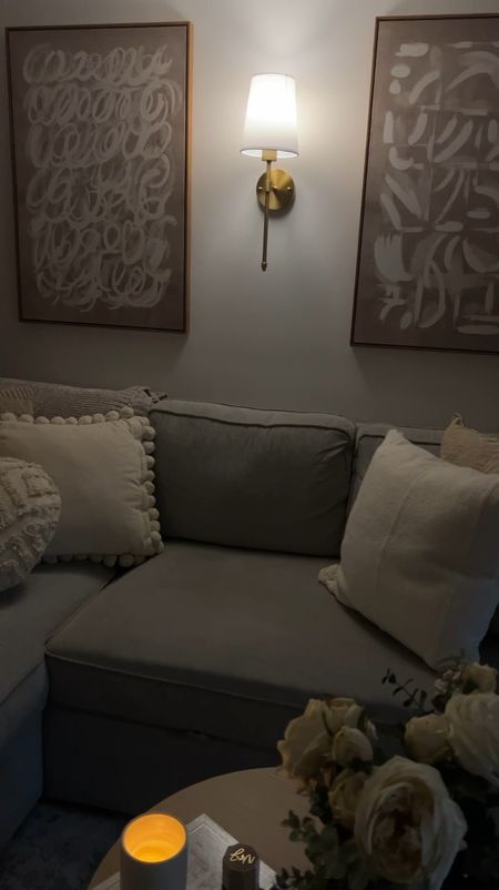 Cozy small apartment living room, small couch with storage, amazon wall art, amazon wall sconce 

#LTKSeasonal #LTKVideo #LTKHome