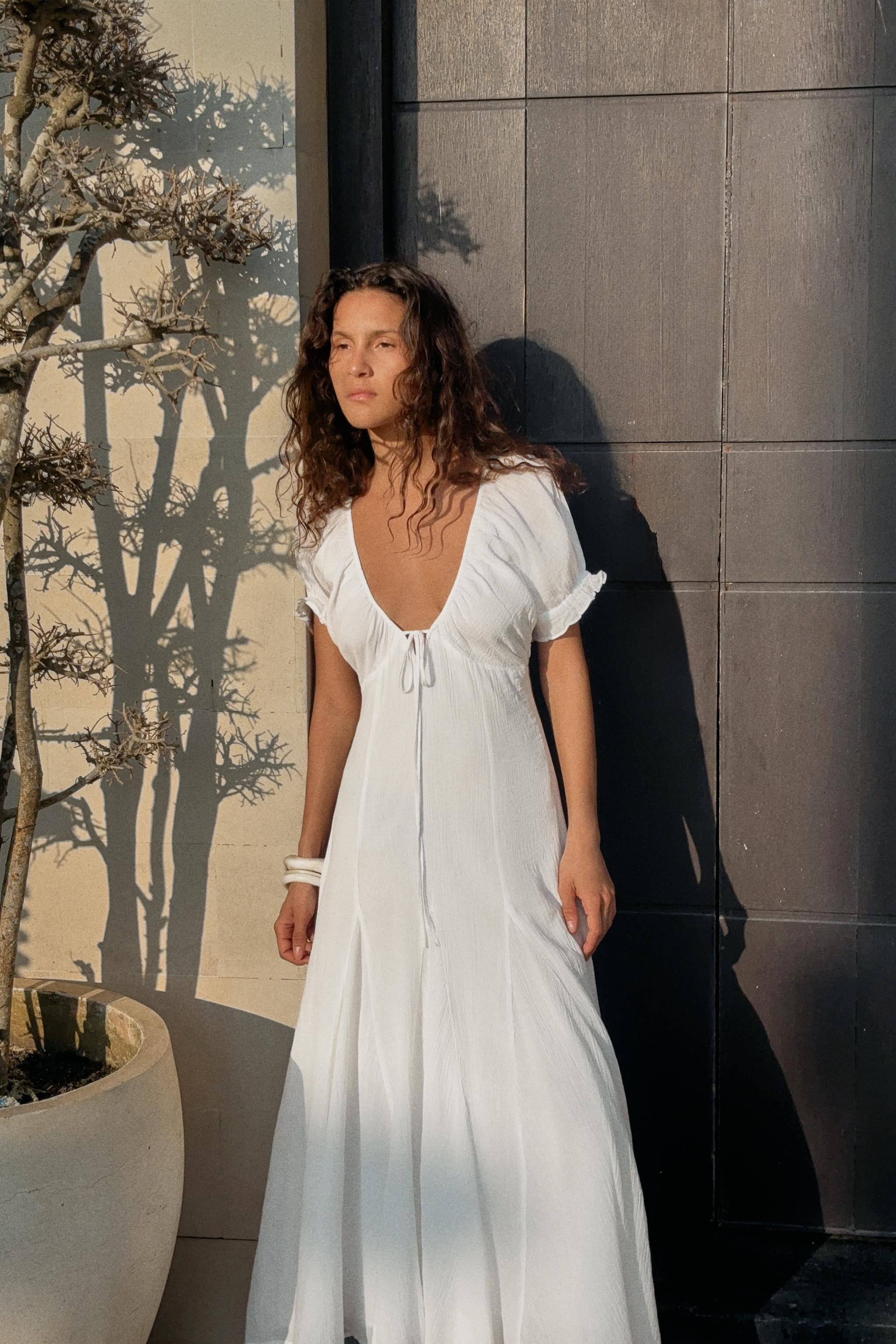 V-neck midi dress with tie. Short puff sleeves. Tonal interior lining. Godet detail. Side hidden ... | Zara US