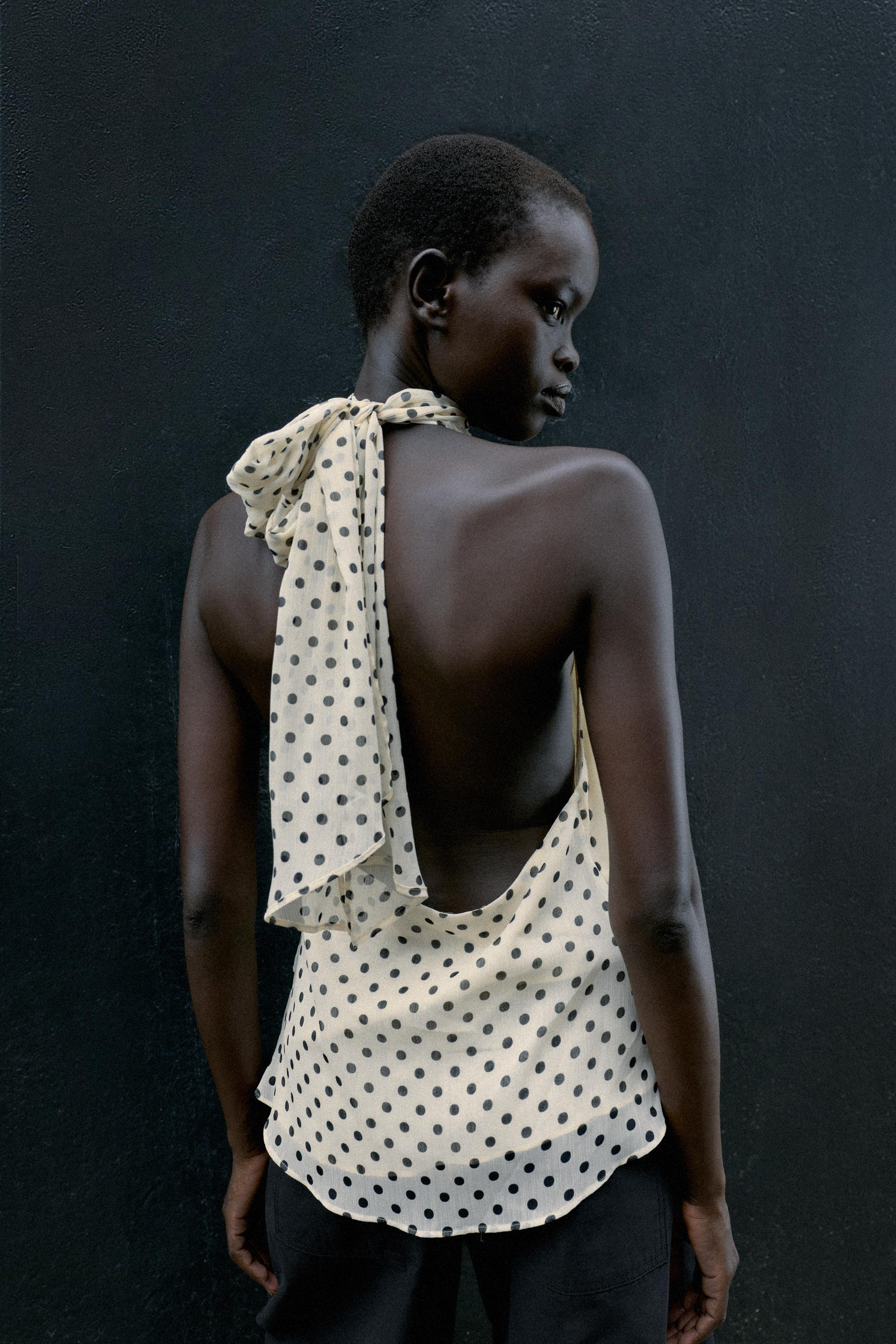 Halter neck top with ruffles and open back. Back hidden button closure. | Zara US