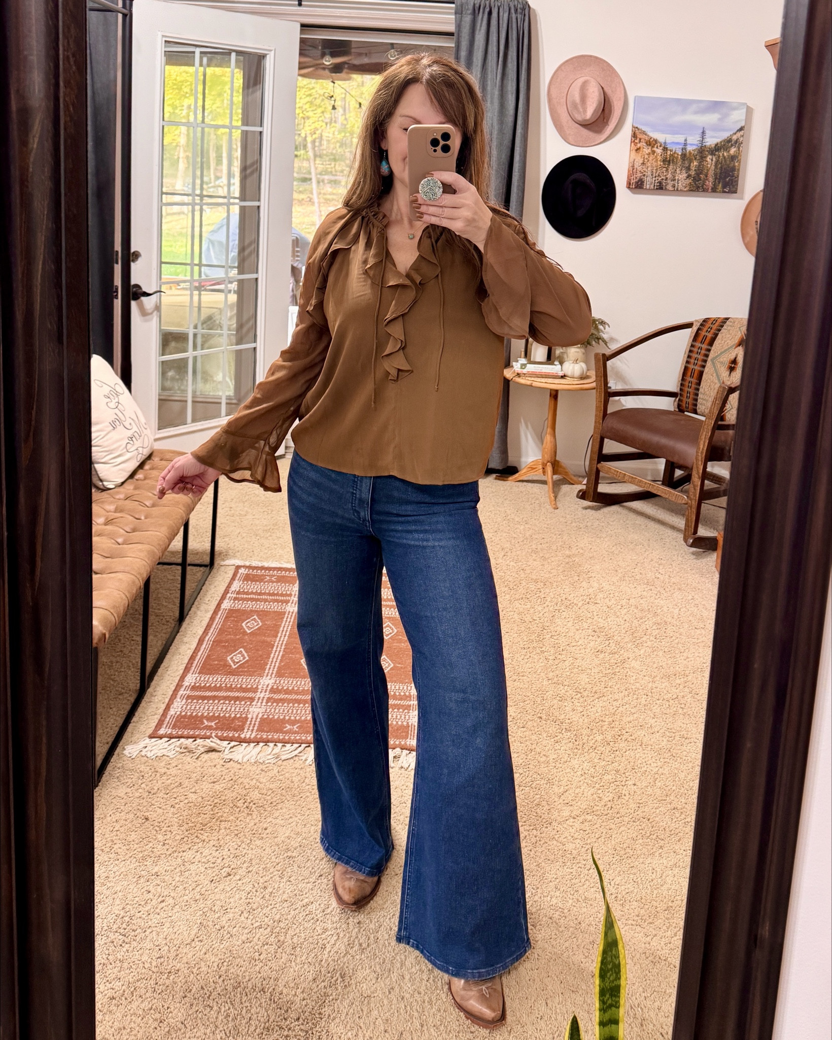 Blouse is a beautiful lightweight sheer (body has an extra layer, no see through) 
Neck has a tie string or can be left undone (as shown) 
Jeans are extremely comfortable and flattering! 
Top: Size medium 
Jeans: size 12
Idyllwind Boots: TTS 

Ruffle blouse, Fall outfit, wide leg jeans, high rise jeans, Sophia jeans, western style, cowboy boots, brown outfitts

#LTKSeasonal #LTKWorkwear #LTKFindsUnder50