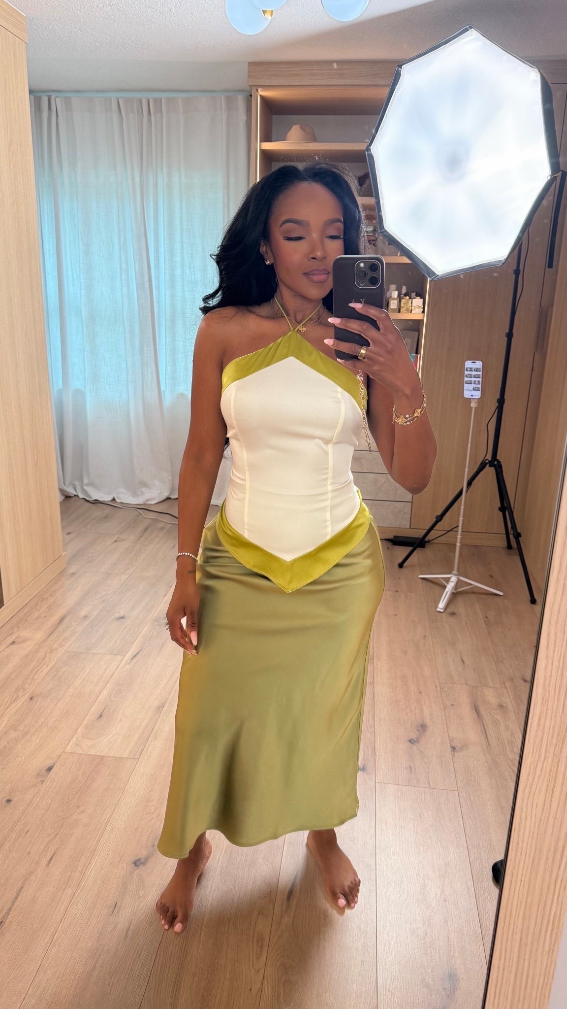Scroll to shop this elevated satin moment featuring a structured halter top paired with a silky midi skirt in a soft olive tone for a flattering, feminine silhouette. Pieces like this can easily be styled up or down, making them a smart wardrobe investment where the cost per wear continues to drop.

Perfect for date nights, vacation dinners, special occasions, girls night out, or an elevated evening look.

5'4" | 138 lbs | 34D bust | 27" waist | 40" hips

Follow me on Instagram and YouTube @kirasfashionfinds

