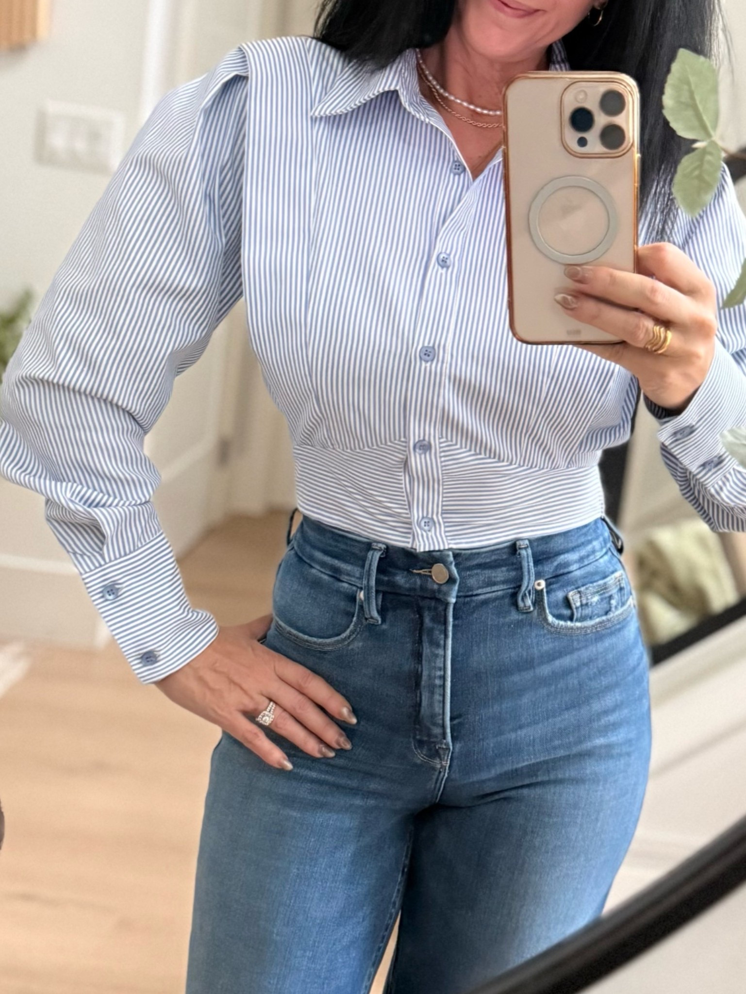 Pinstripe cropped blouse. An updated classic. Note: it’s definitely cropped, lol 
Love it paired with high waisted denim!