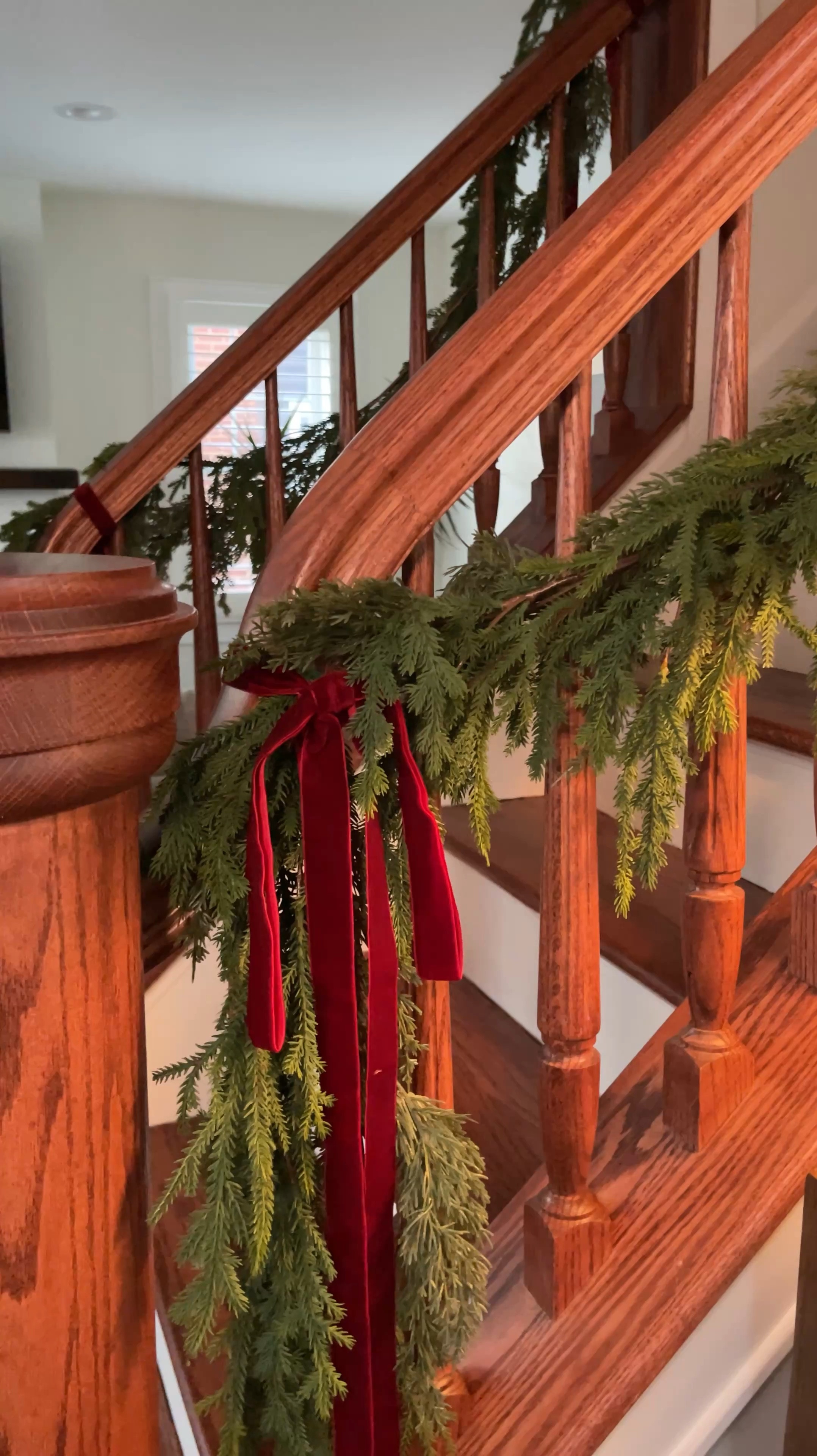Holiday staircase — garland and velvet ribbon bows 

#LTKHoliday