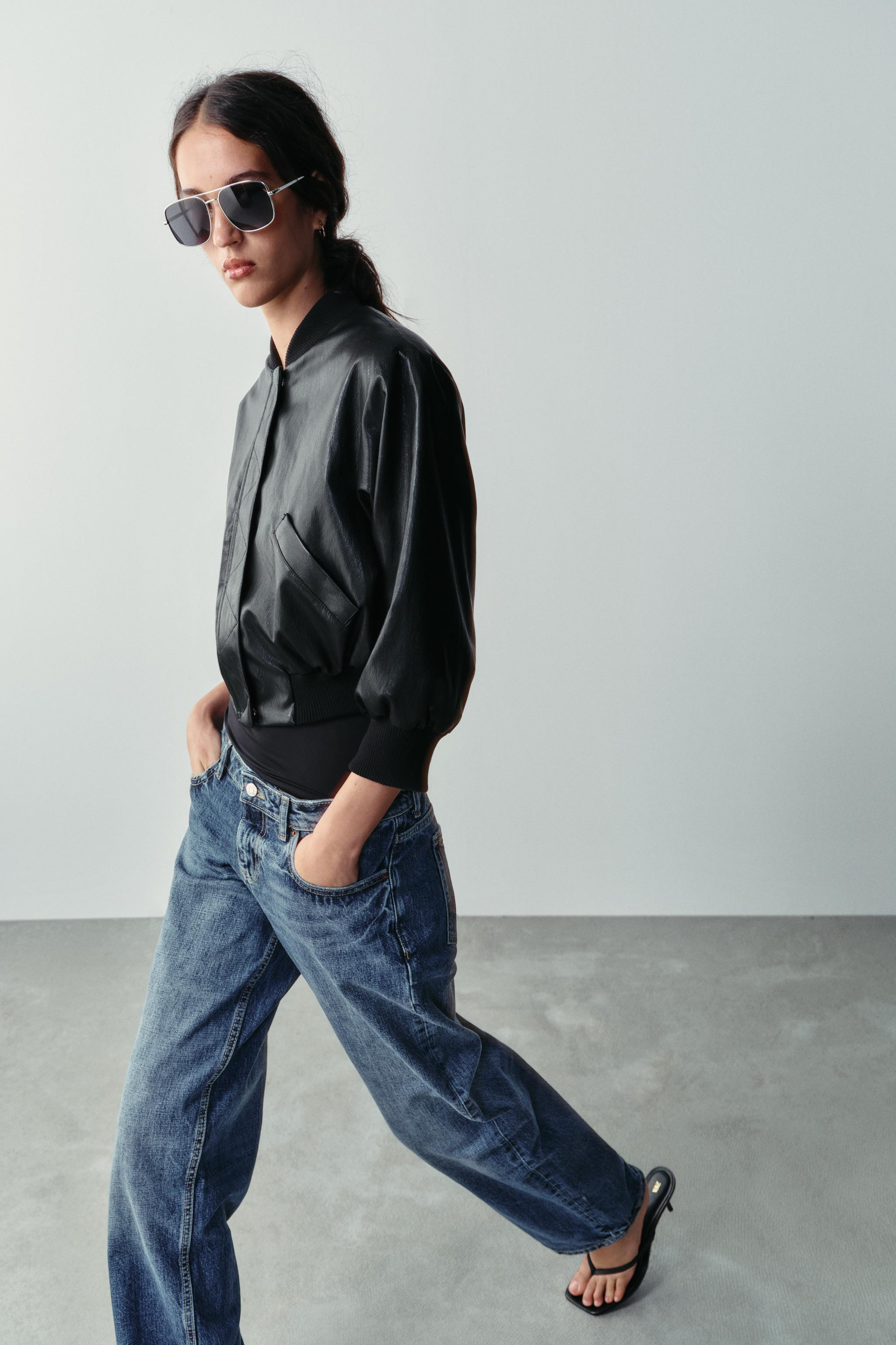 Short bomber jacket with a round neck and long sleeves with cuffs and shoulder pads. Featuring fr... | Zara US