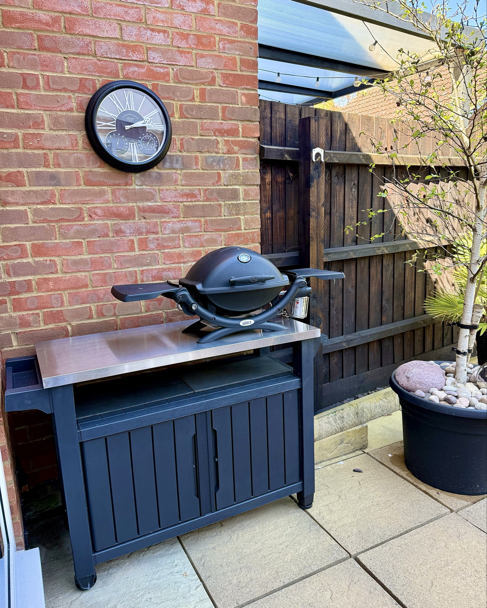 Hi everyone! The sun is shining &amp; it’s time to be in the garden rather than be stuck in the house. BBQ season is here &amp; we had our first one yesterday. I’m so pleased with my new BBQ table with a much needed storage cupboard underneath &amp; stainless steel worktop. It’s perfect for an outdoor kitchen area. We using a Weber gas BBQ but hoping to upgrade it to a larger one soon. The stylish outdoor wall clock in black matches perfectly  

U.K. blog, home, house, furniture. 


#LTKsummer #LTKspring #LTKhome