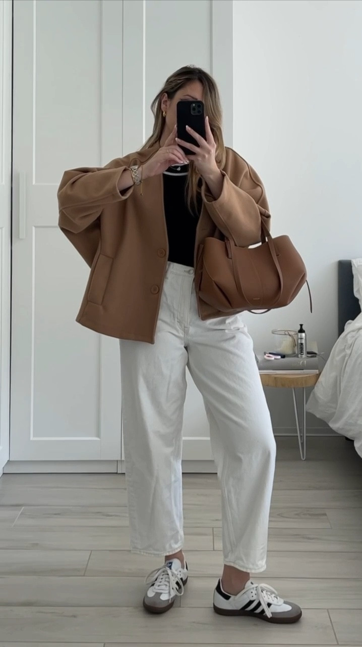 Spring casual outfit with camel, black and white tones 🍪🤍 

@hellomoonshop jacket
@massimodutti contrasted tank top
@cos tapered white jeans (I’m wearing size 32 - I went 2 size up for more comfort)
@adidas samba classic OG

#LTKSeasonal #LTKstyletip #LTKVideo