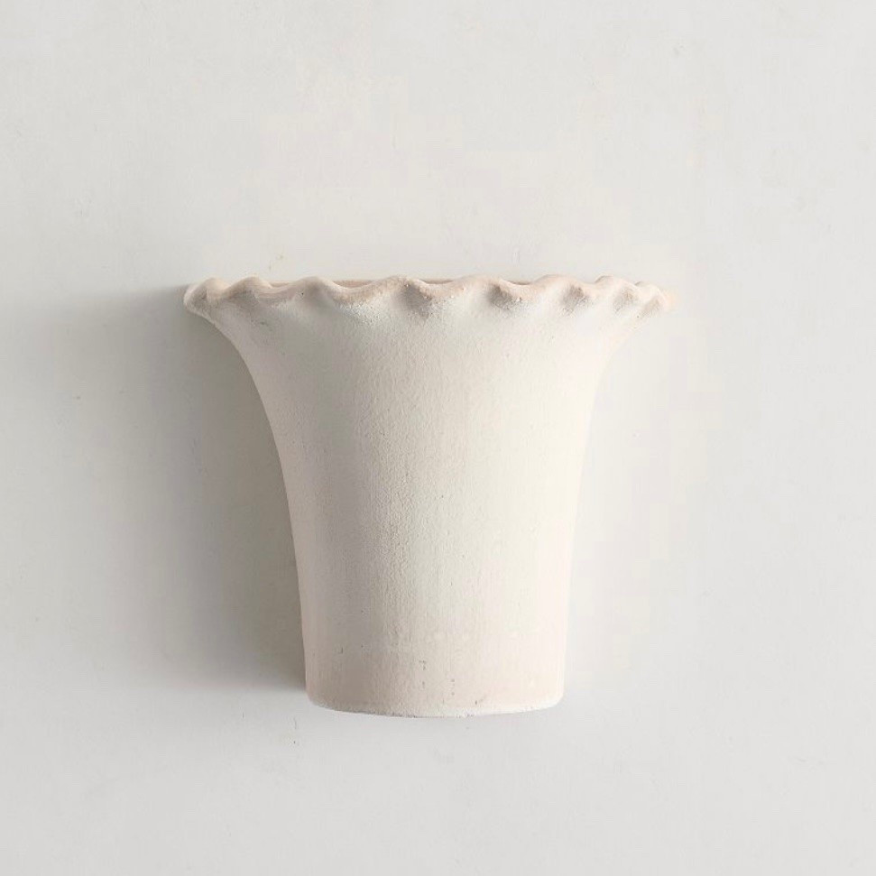 A wall vase?! I’ve seen so many this year! There were few and far between prior to my 112 million viewed video ;) This is the same design as the planters I have got a few of last spring! The planters come in terracotta and black.

#LTKHome