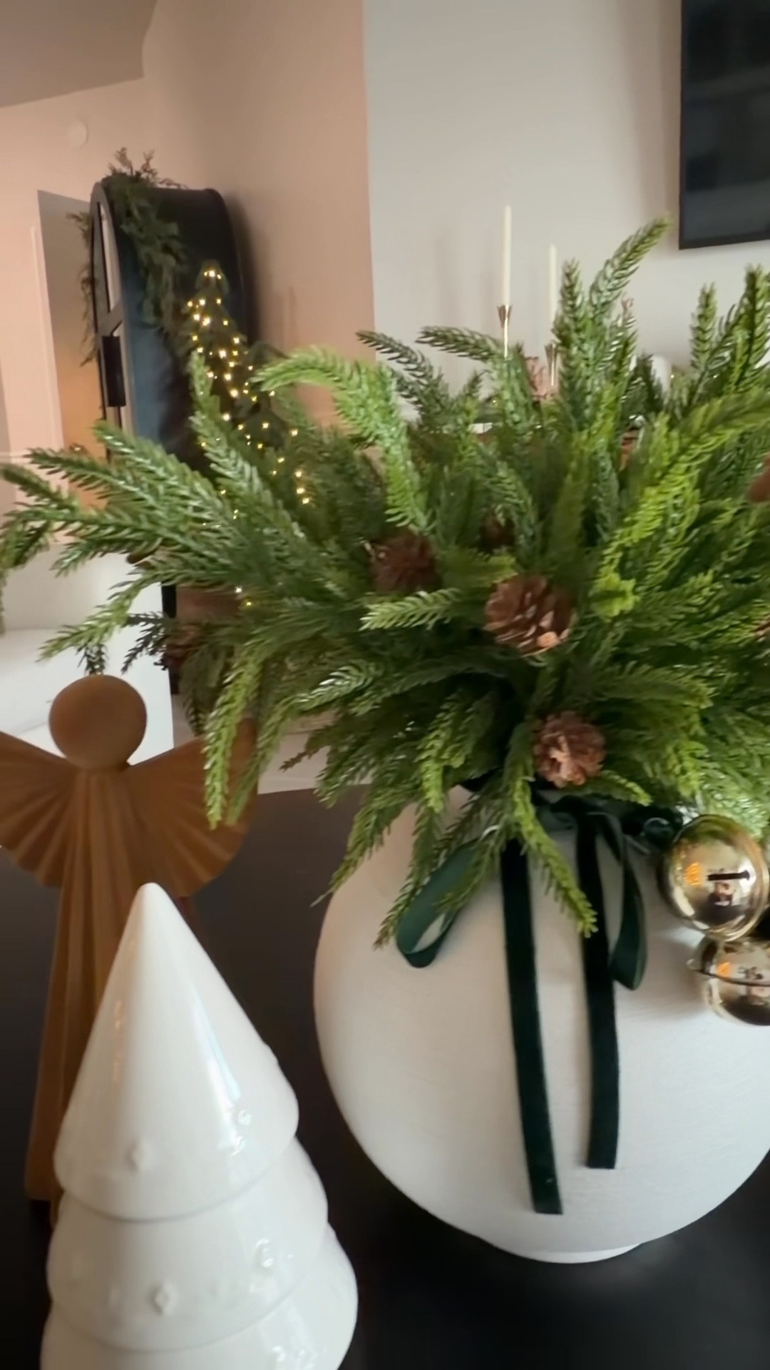 Hi ya’ll . Here’s a simple and affordable Christmas arrangement . Loving these branches from Amazon . For under  $25 you can get a full set of these Norfolk branches and they are amazing quality . I actually just used half of the branches & still looks full. I also wrapped some velvet ribbon and bells around the vase . What do you think ?? 

#LTKHome #LTKHoliday #LTKSaleAlert