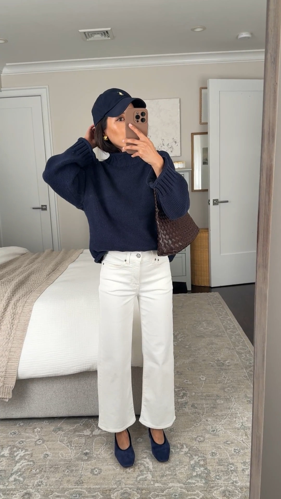 Classic chic mom outfit. Same jeans also come in scallop edge!

• Slim wide jeans 24 petite, TTS, a longtime petite favorite, has stretch and is a little loose at waist for me

• Suede navy ballet flats TTS so comfy with no breaking in needed. low stacked heel, supportive on the inside

I also love the Madewell flats linked in 5.5 for a darker navy 

• Navy cotton sweater xxs, oversized relaxed fit with shorter length, thicker knit, can shrink a little bit in the dryer 

• Anthropologie woven shoulder bag with liner

• Polo hat

Easy mom outfit, petite friendly jeans, transitional spring workwear outfit, rollneck sweater, white jeans

#ltkworkwear #ltkmomlife #ltkpetite