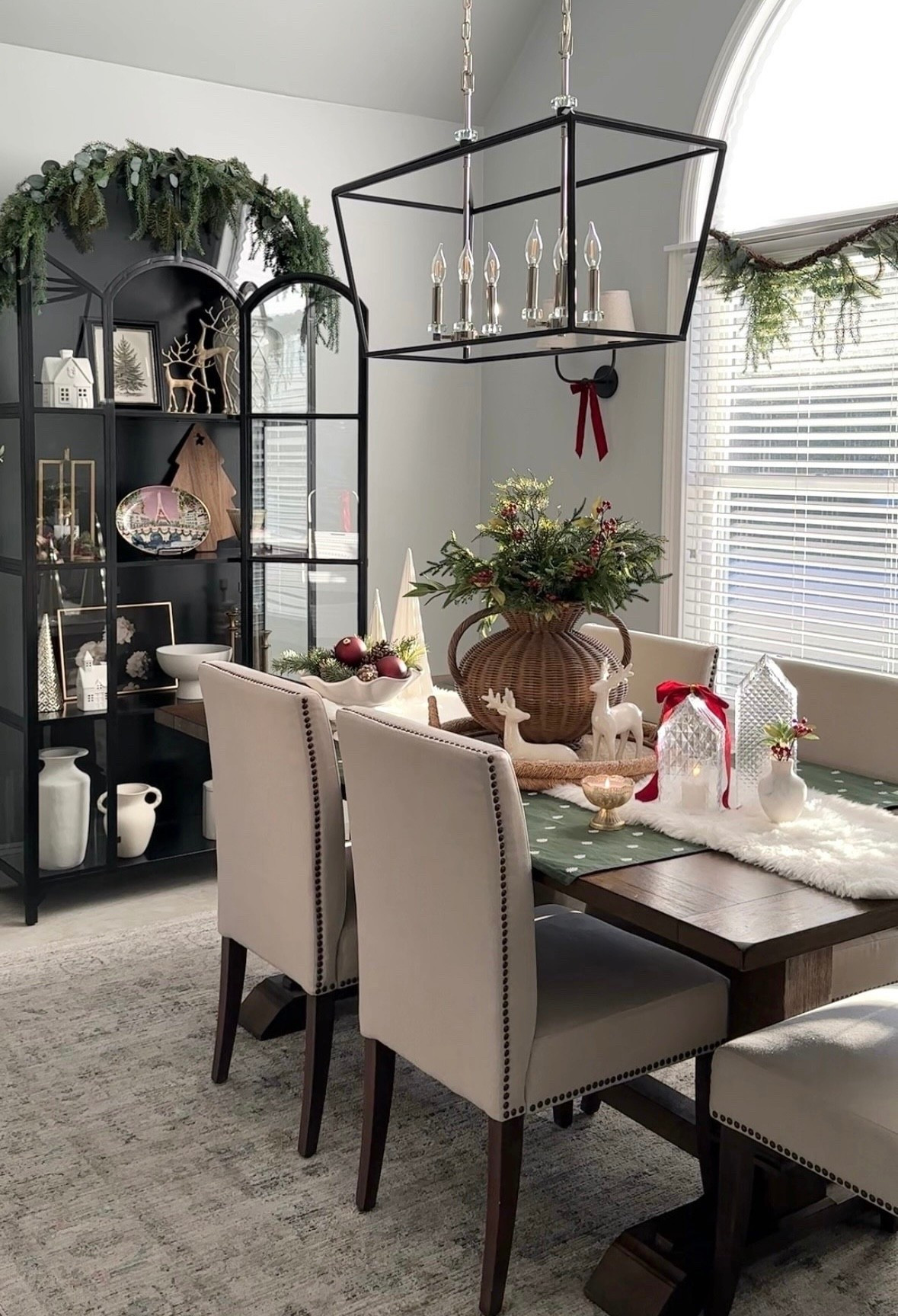 Christmas dining space styling! Shop black display cabinet, chandelier, sconce, similar chairs and wood table, woven vase, greenery, crystal houses, mercury candles on sale shop free, brass reindeer, holiday plater, ruffle bowl, table top trees, vases, wood board, holiday houses, coastal trays. Pottery Barn, Crate & Barrel, Amazon home, Target, Anthropologie, Wayfair, Walmart. Sales, free shipping. 

#LTKHome #LTKHoliday #LTKSaleAlert