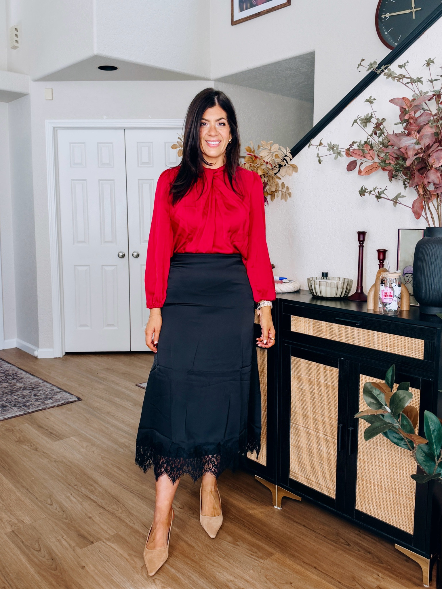 Workwear under $50
In a medium satin top and medium lace skirt