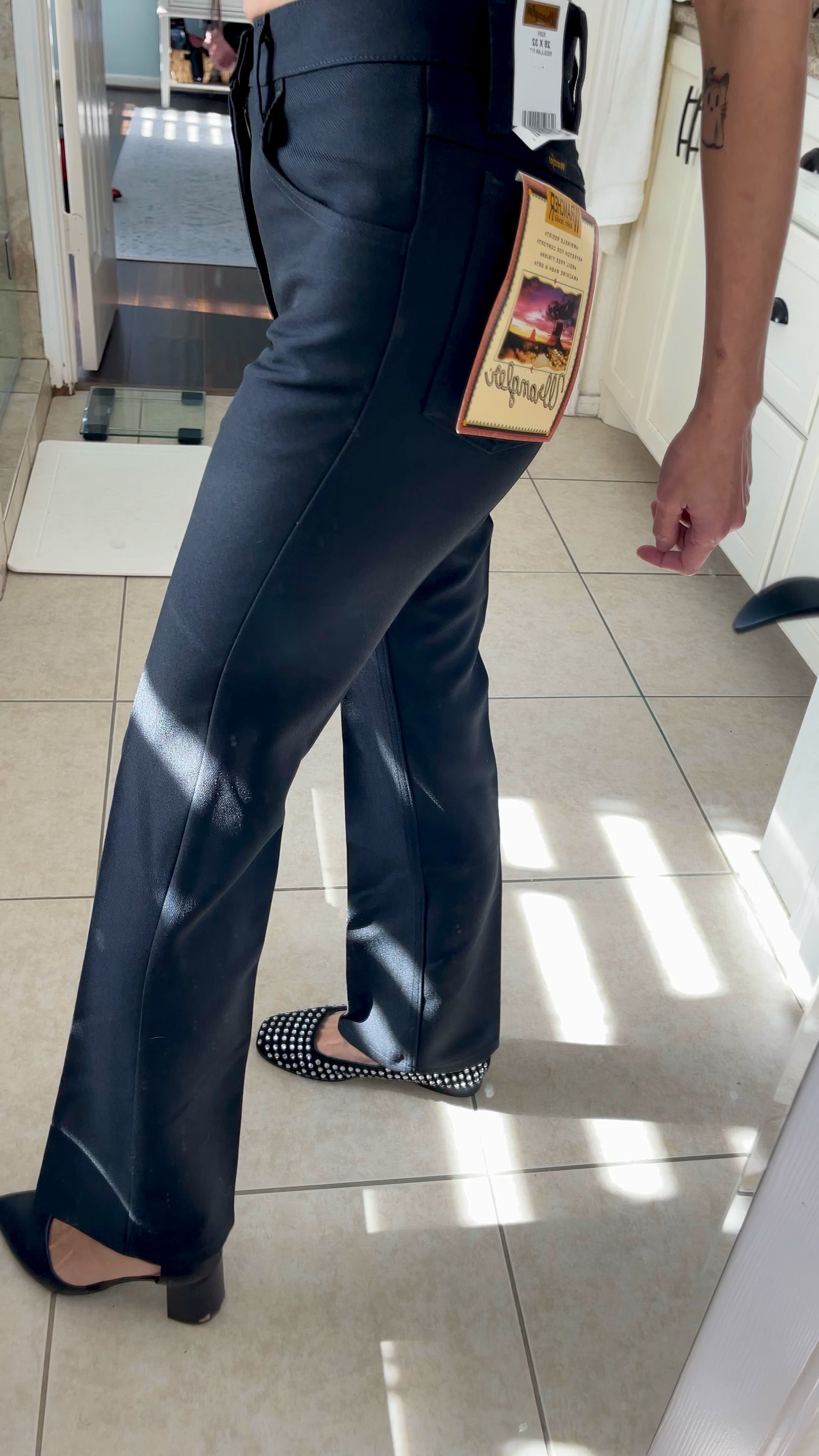 ⭐️ LTK Spring Sale!⭐️ Shop these pants and the rest of the Wrangler site March 8-11th for an *in-app exclusive discount!* 👈🏼 

Fit and styling tip for the Wrangler Wrancher dress jeans (which are not denim but a sleek denim-like polyester material). 

SIZE UP! Between my husband and I we have ordered six different size combinations in these pants to find the perfect fit. 

I found that I sized up 2 sizes (Normally sz 26/27 waist depending- 28 shown here is snug but fits, but not my favorite fit to sit down in. The 29 waist fits well. 

Now let’s talk length-  get the men’s cut if you want a longer inseam. They’re offered in 30, 32, and 34” inseams whereas the women’s ones are only available in 31” inseam. 

related: Rodeo western inspired outfit menswear country 

#LTKsalealert #LTKSpringSale #LTKstyletip