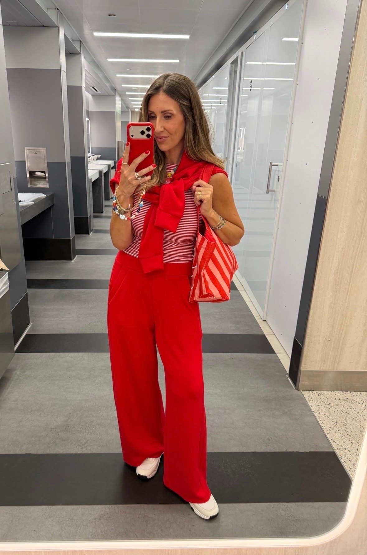 Loving this red and white combo. The striped tank, wide leg pants, and sweater draped over the shoulders make it feel polished, comfortable, and perfect for summer events, travel days, or holiday weekends.

red white and blue outfit, patriotic style, summer outfit, wide leg pants, striped tank, americana fashion, fourth of july outfit, holiday weekend style, chic casual outfit, summer fashion, travel outfit, elevated basics, colorful accessories, outfit inspiration, themominstyle

#LTKTravel #LTKSeasonal #LTKootd