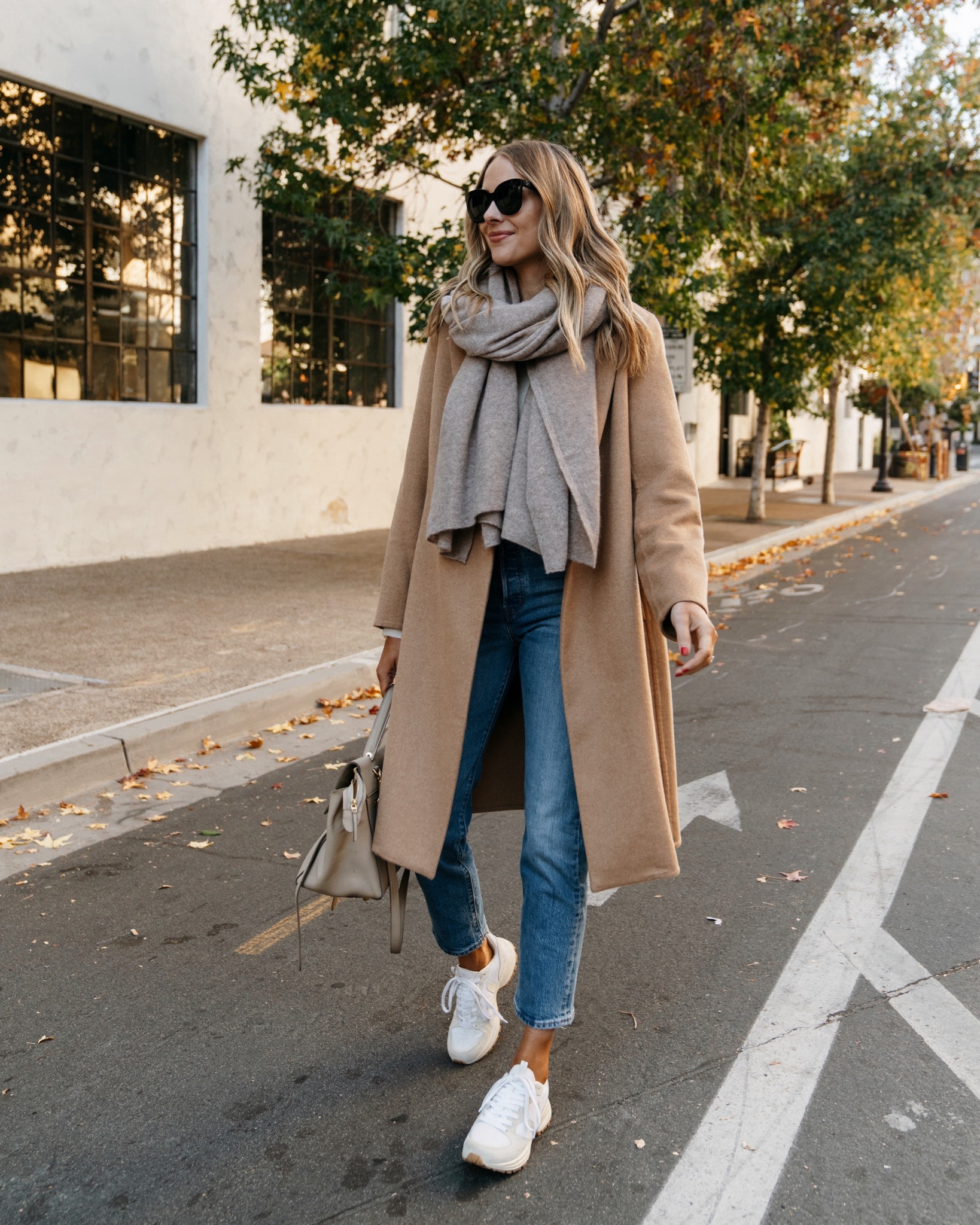 Fashion Jackson wearing camel coat, jeans, veja sneakers, scarf #falloutfit #thanksgivingoutfit #sneakers 

#LTKSeasonal #LTKshoecrush #LTKstyletip