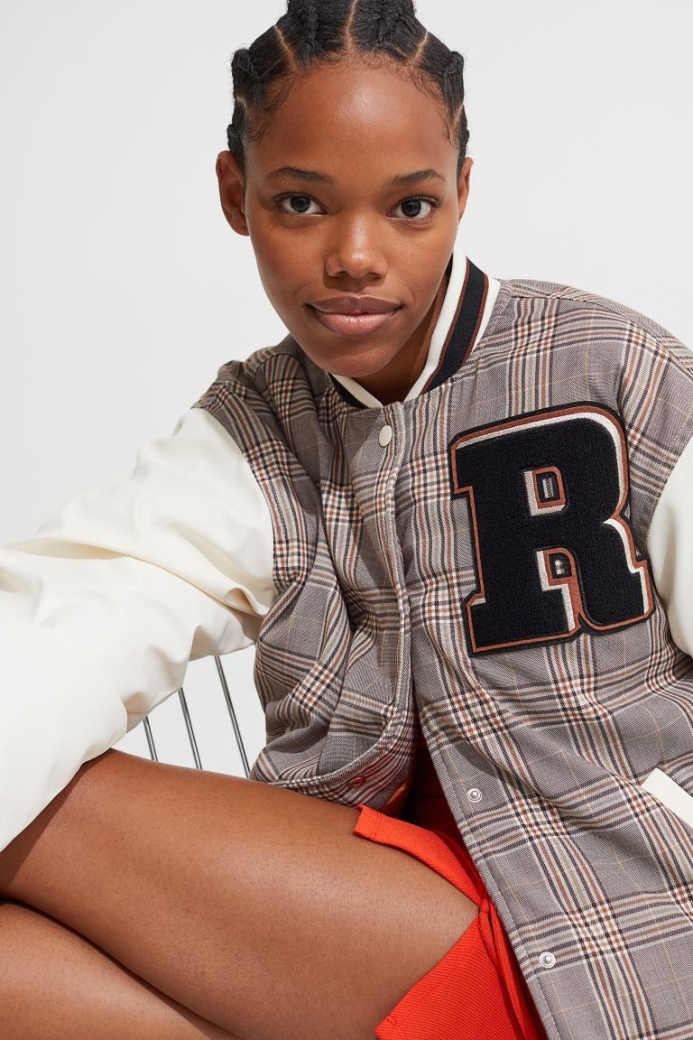 Conscious choice  New ArrivalBaseball jacket in twill with padded sleeves in woven fabric. Embroi... | H&M (US + CA)