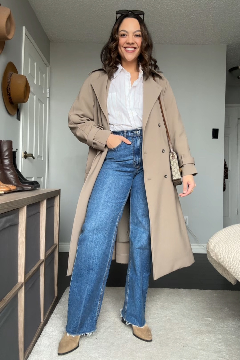 Styling a button up shirt and a pair of jeans:
-Striped button down shirt, similar linked. 
-Abercrombie high rise relaxed jeans in medium wash. I have a size 30 long. 
-Suede heeled ankle boots, similar linked. 
-Oak + Fort oversized trench coat, I have the colour brindle and a size medium. 
-Gucci horsebit canvas mini bag. 
-Celine Triomphe dingo. 


#LTKSeasonal #LTKfindsunder100 #LTKstyletip