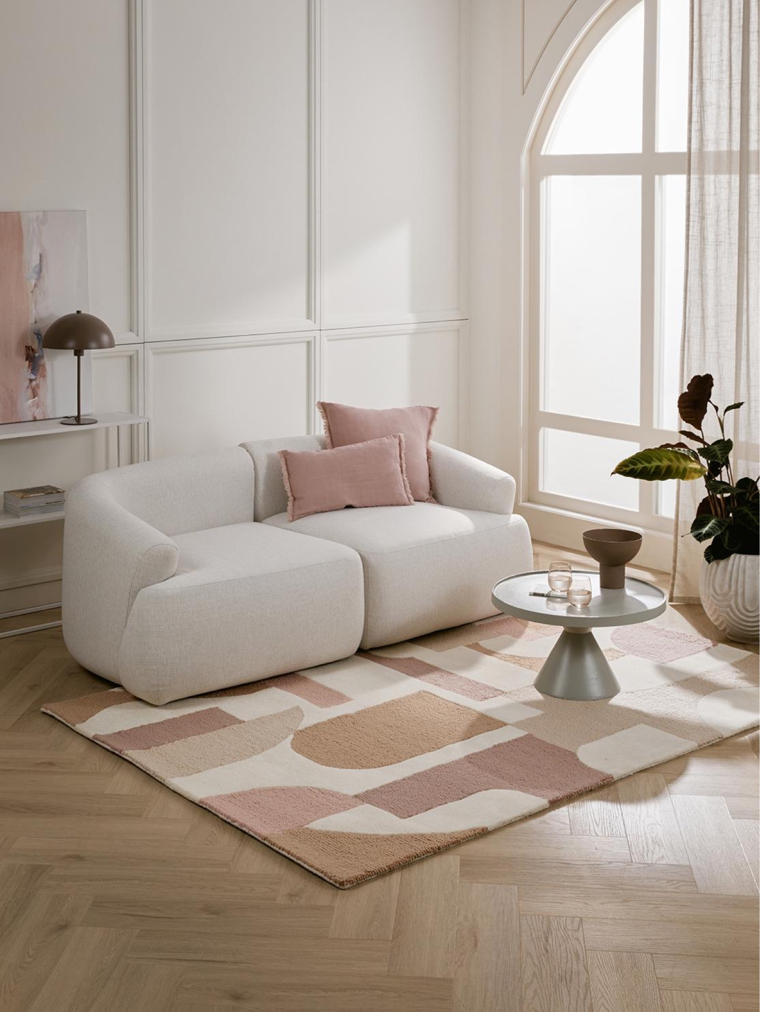 New ways to style a living room. White rounded couch, pink pillows, pink decorative rug. Parisian styled apartment, Parisian style home - how to style your living room #Westwing WestwingNow Westwing collection 


#LTKhome #LTKstyletip #LTKeurope