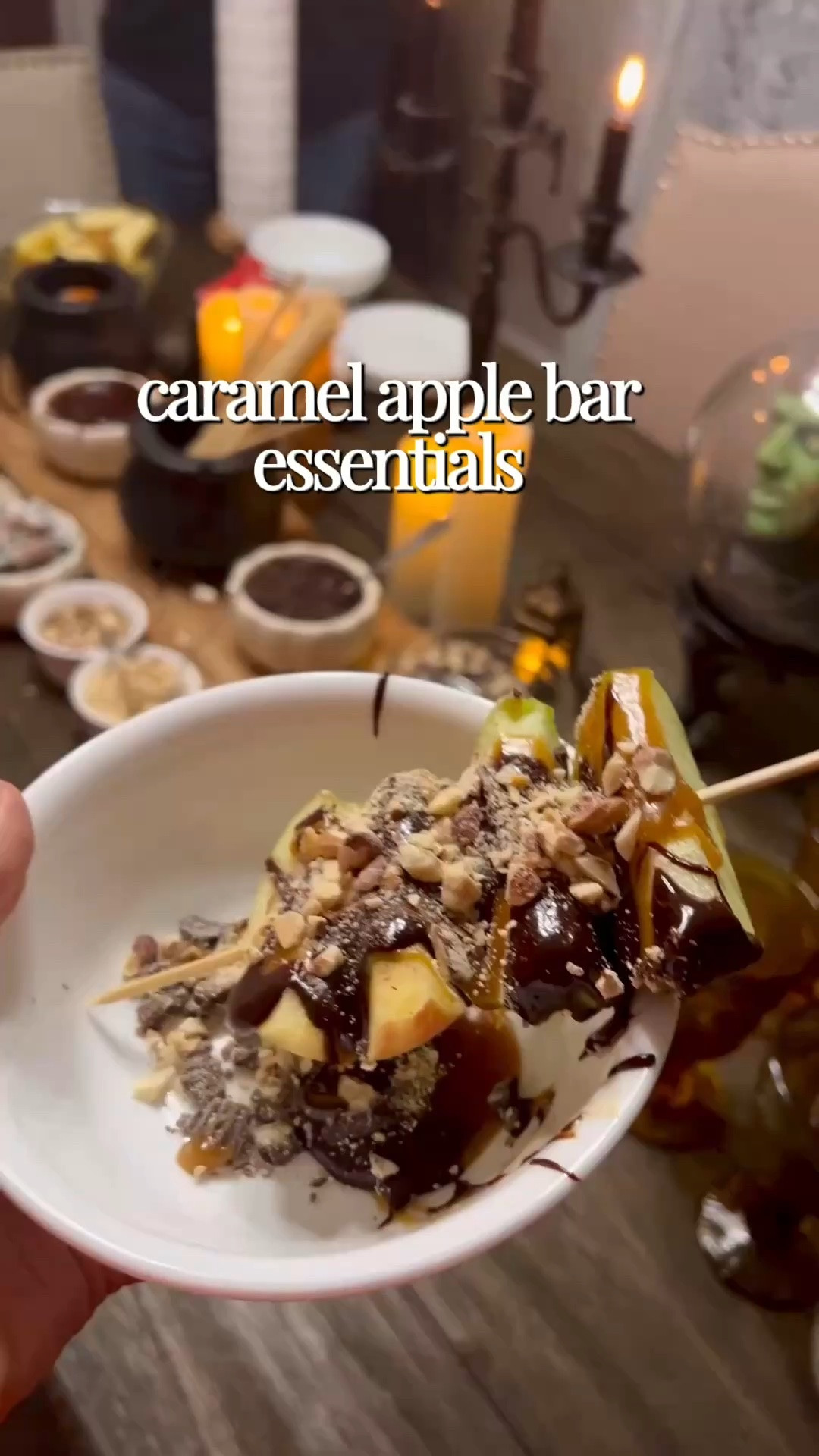 How to make my caramel apple bar:

-start with setting up the table with the wooden skewers, candles, DIY cauldrons (see other posts), charcuterie boards, and bowls. 
-crush up unreal candles and nuts 
- pour each of those + mini chocolate chips into individual bowl
-add the rest of whole candies  inside the small cauldrons
-melt 1-2 bags of enjoy life chocolate chips with a small of almond milk and stir until smooth
-heat up the carmel sauce 
-pour into pumpkin bowls
-at the very end, cut up the apples and place on large bowls on the table