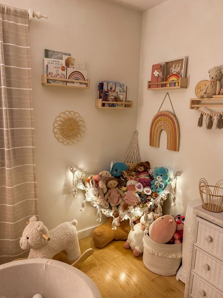 Nursery, neutral blush boho baby girl room! Toddler bedroom design idea. Stuffed animal canopy, storage. Natural wooden book shelves, baby girl play room 🤍

#LTKstyletip #LTKbaby #LTKkids
