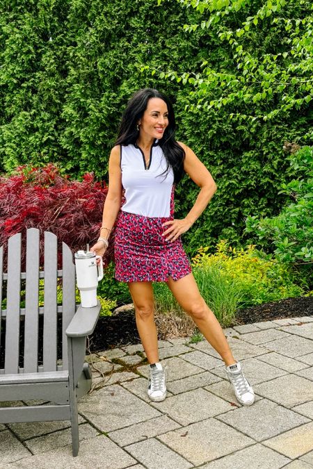 Athletic  sleeveless top with skort
Floral printed pull on skort with 2 pockets.  Italian stretch fitness material. Great for golf, fitness, pickleball, leisure. Tropicana, navy and white.  Two tuxedo stripes down sides in navy.  Back pocket. 15.5" length. 

#LTKActive #LTKStyleTip #LTKFitness
