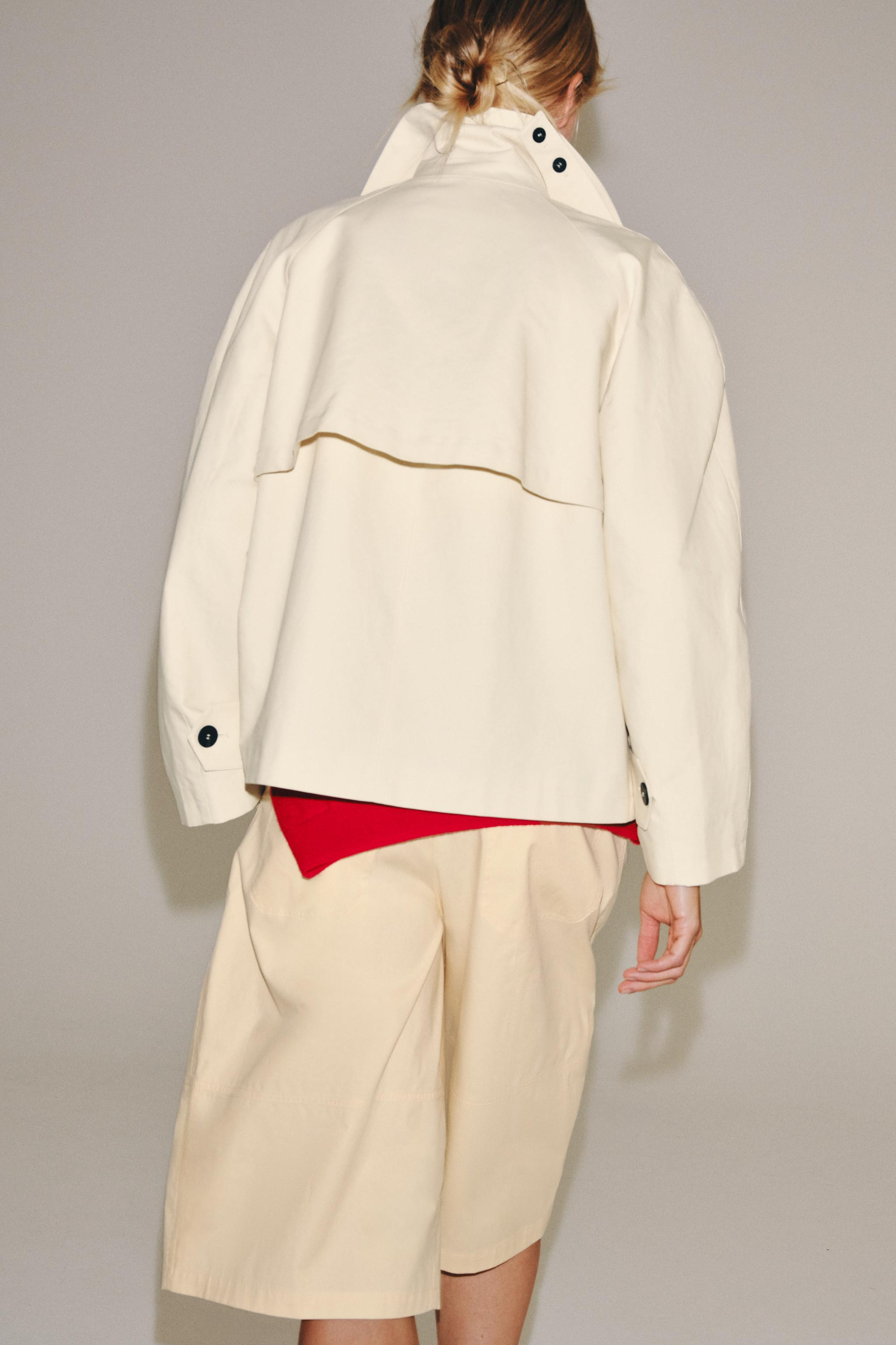 ZARA WOMAN COLLECTIONTrench coat in a cotton fabric. Featuring a high neck and long sleeves. Side... | Zara UK